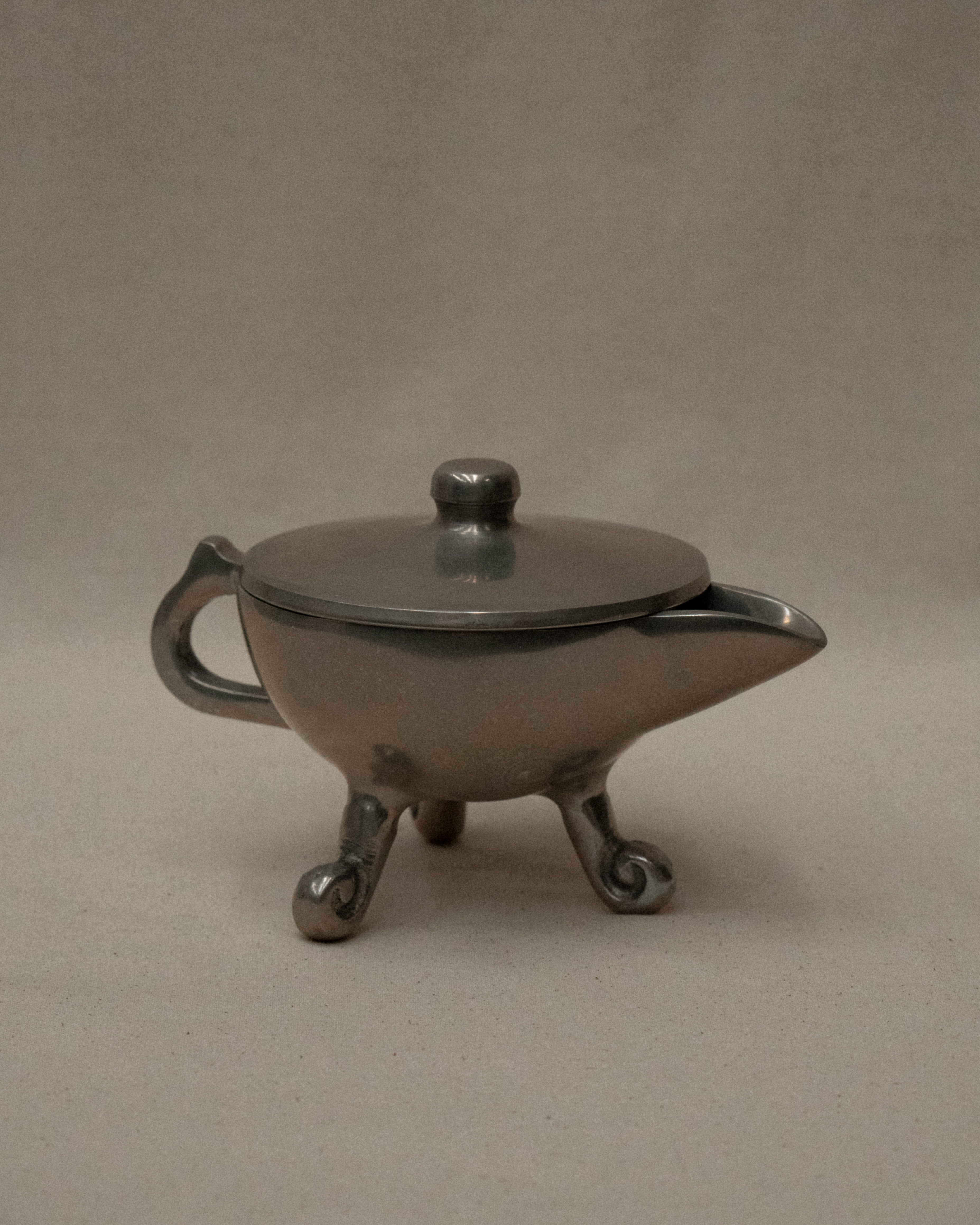 Aluminum teapot trinket holder with spiral feet