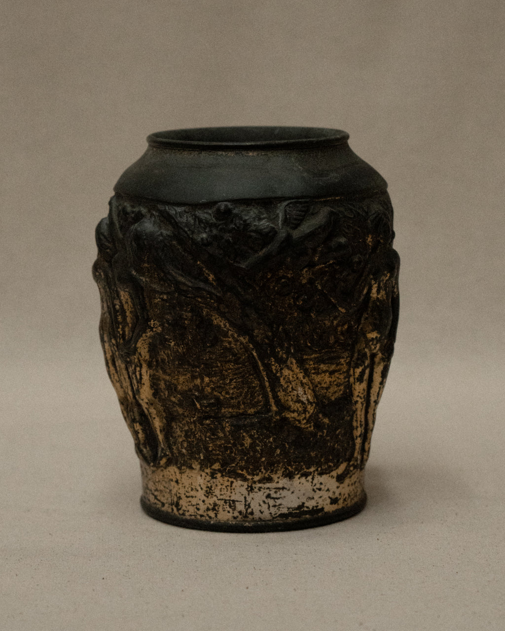 Art deco metal vase with nude figures and angel amongst nature