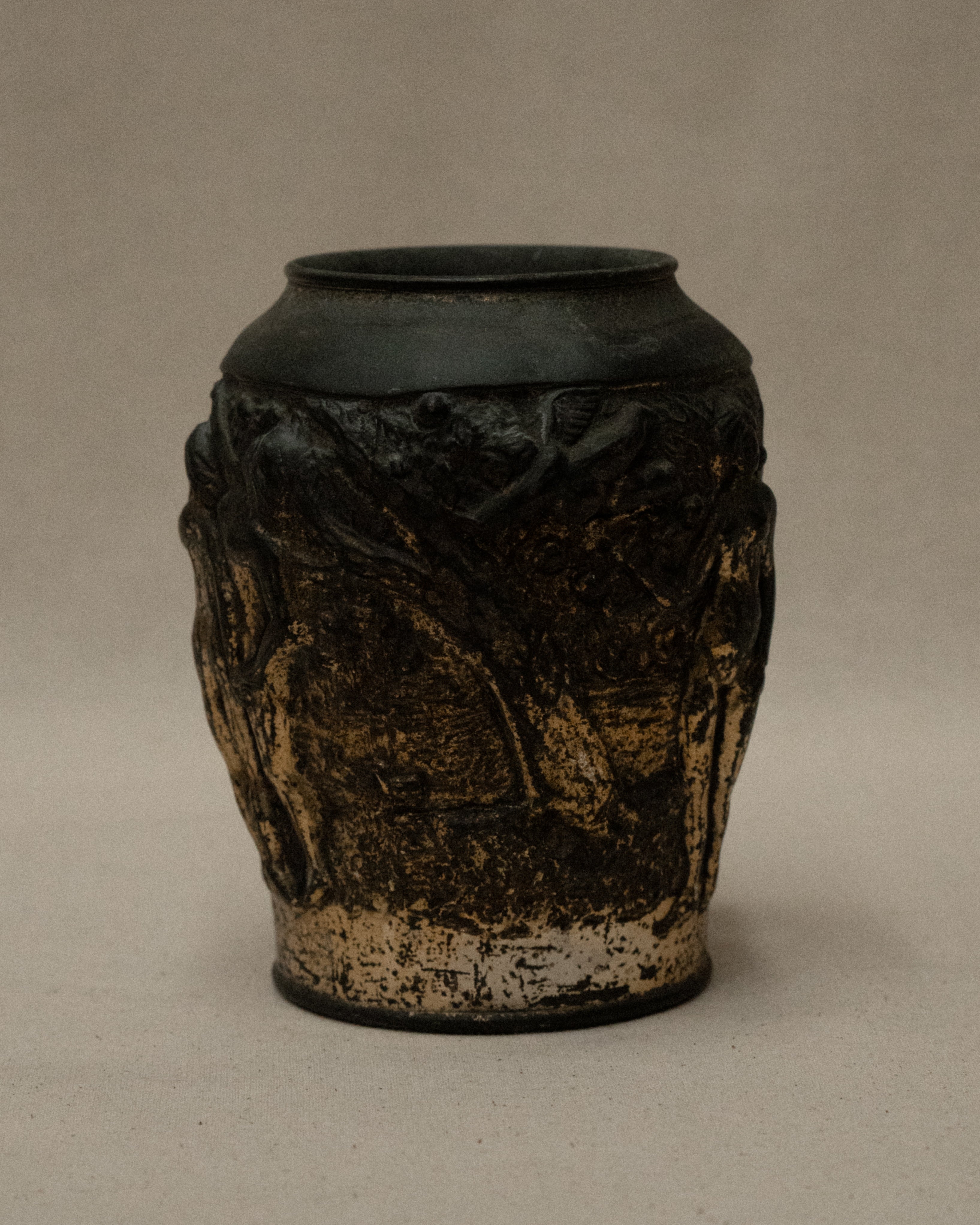 Art deco metal vase with nude figures and angel amongst nature