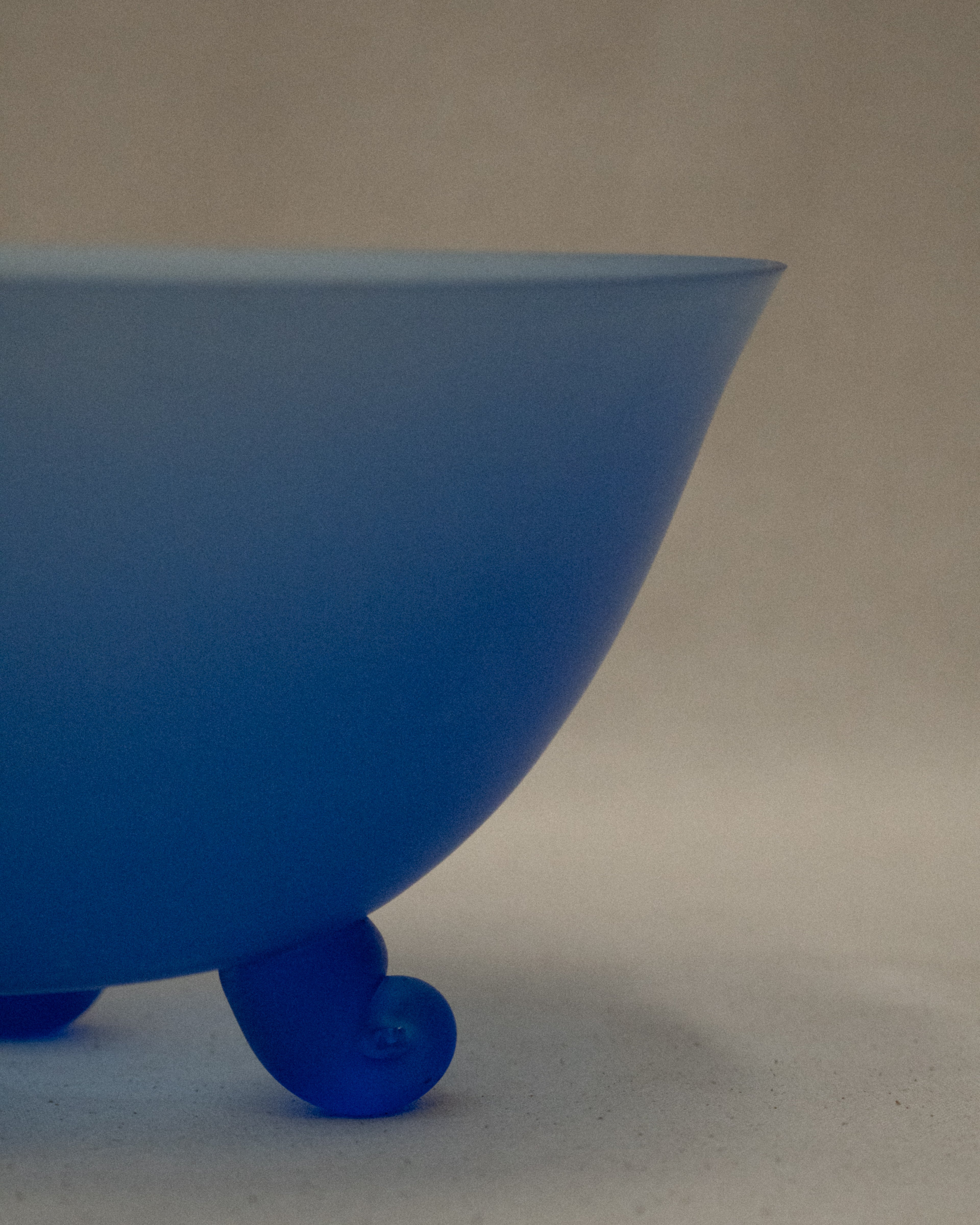Blue glass bowl with spiral feet
