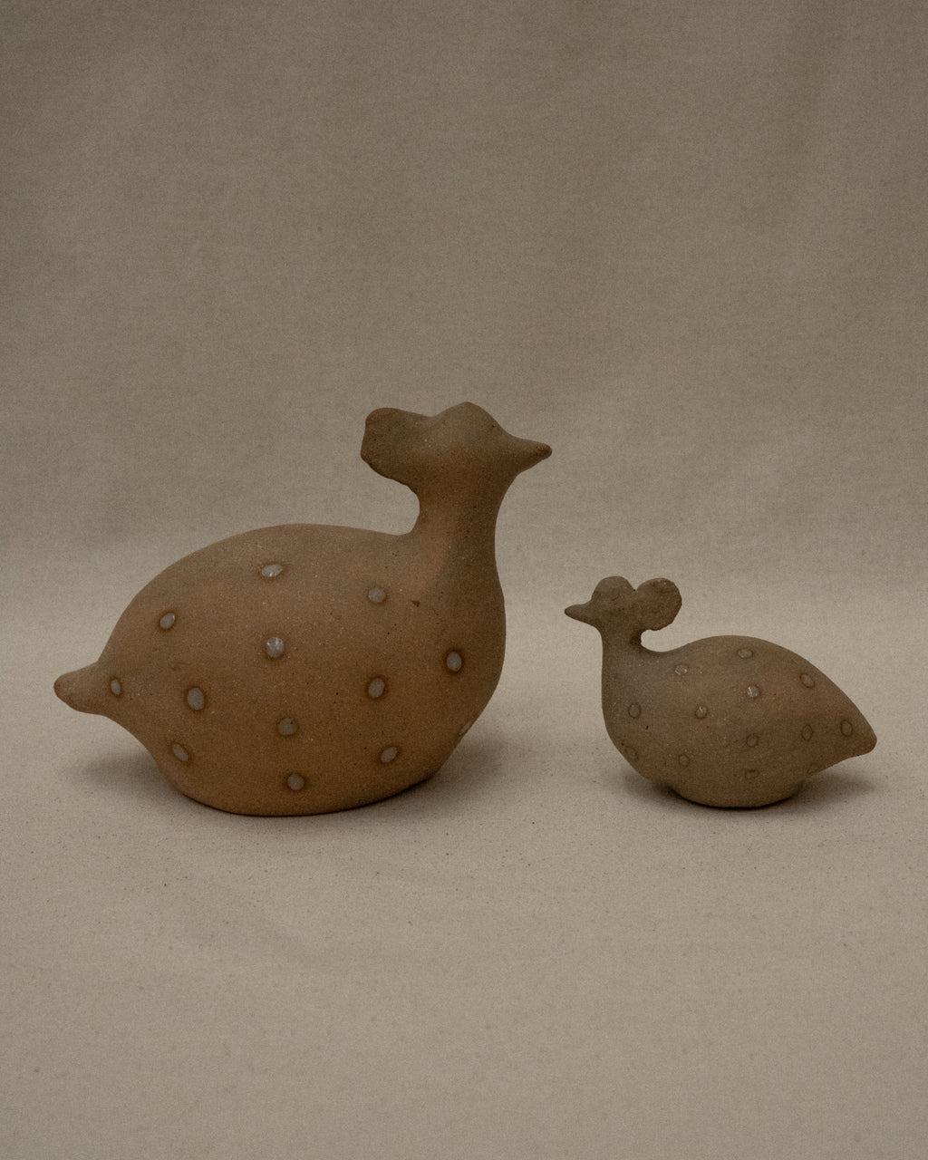 Ceramic toucans and guinea fowls