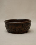 Solid handcarved wooden bowl with rhino engravings