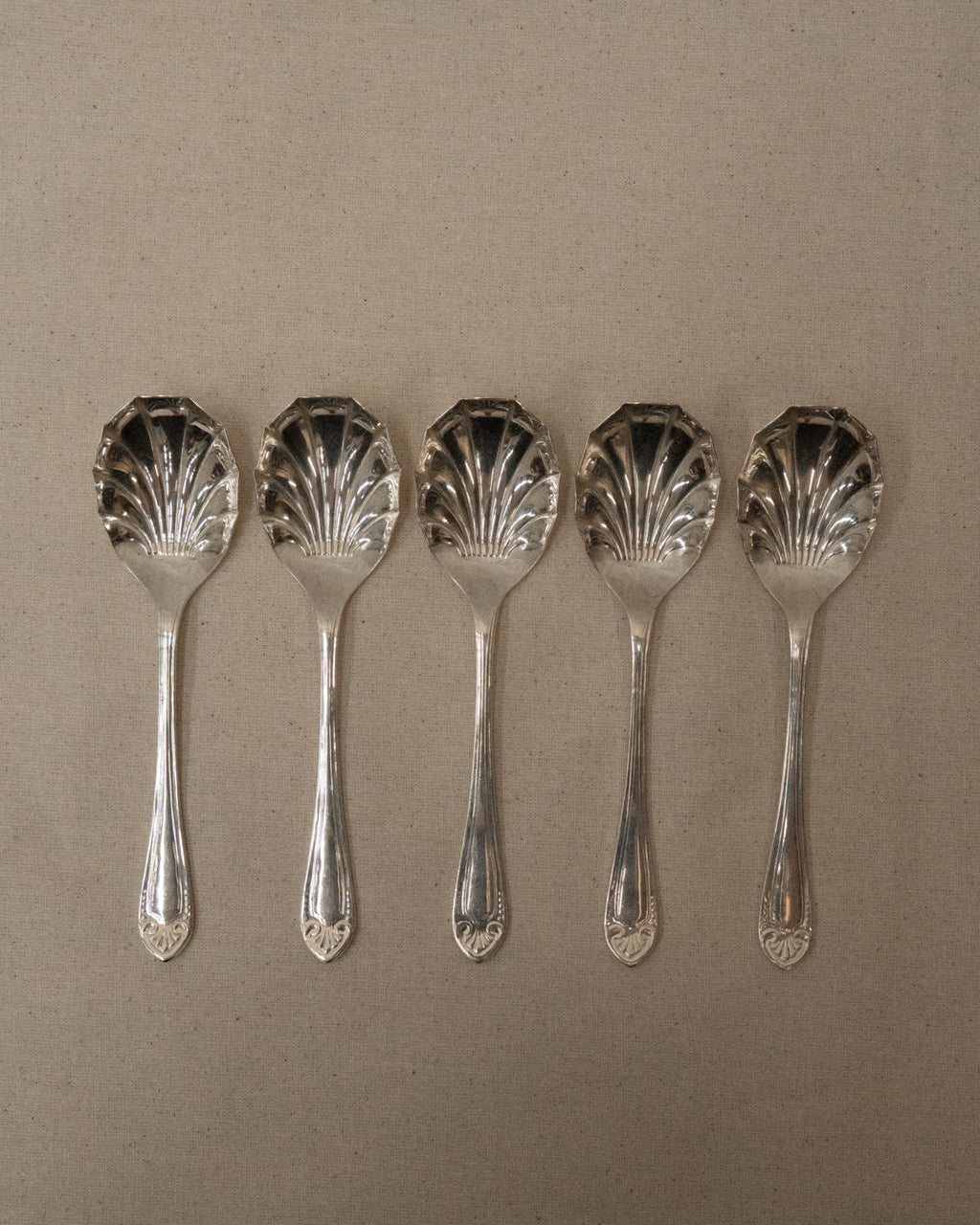 Set of 5 shell shaped silver plated dessert spoons