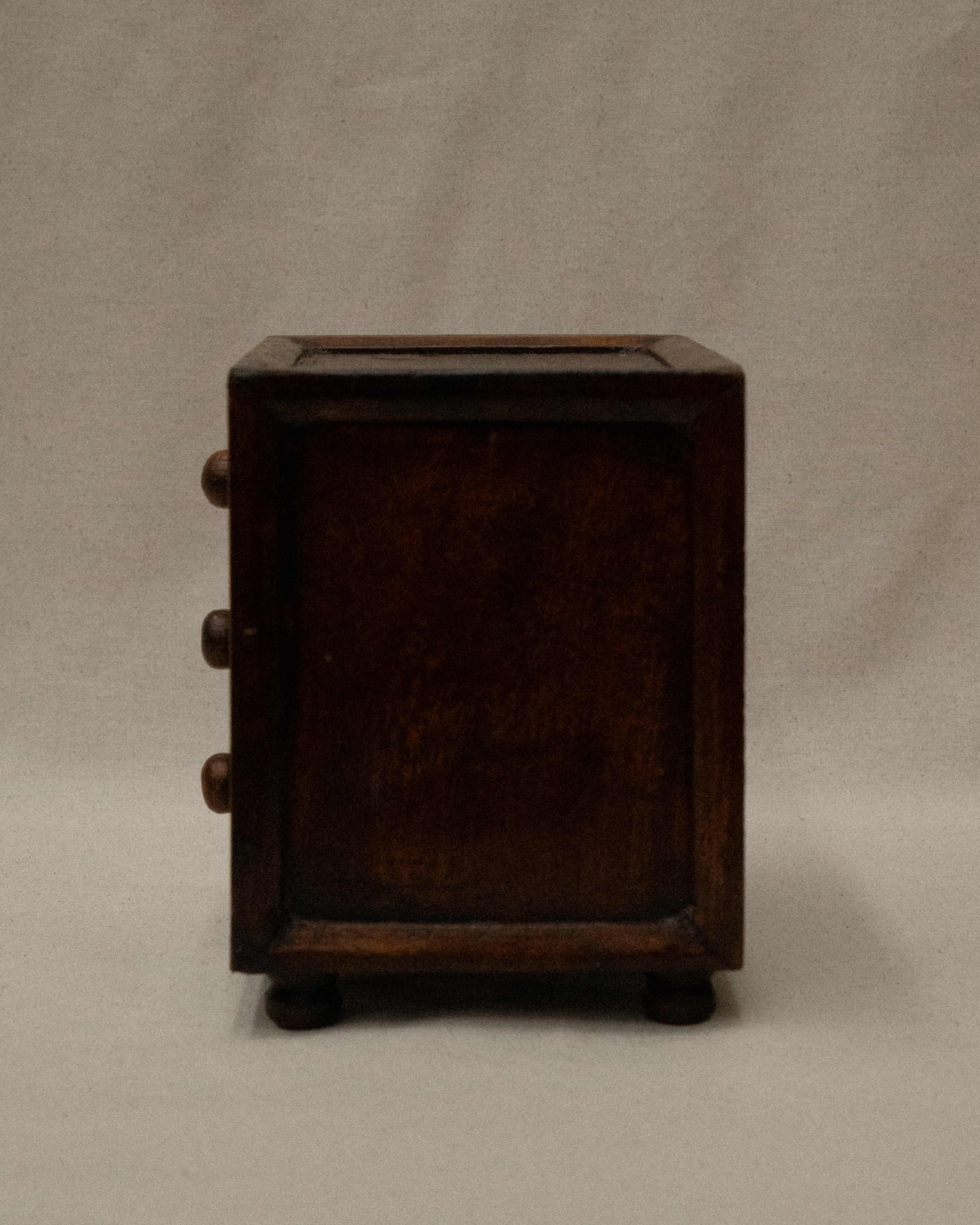 Wooden box with metal front and three drawers