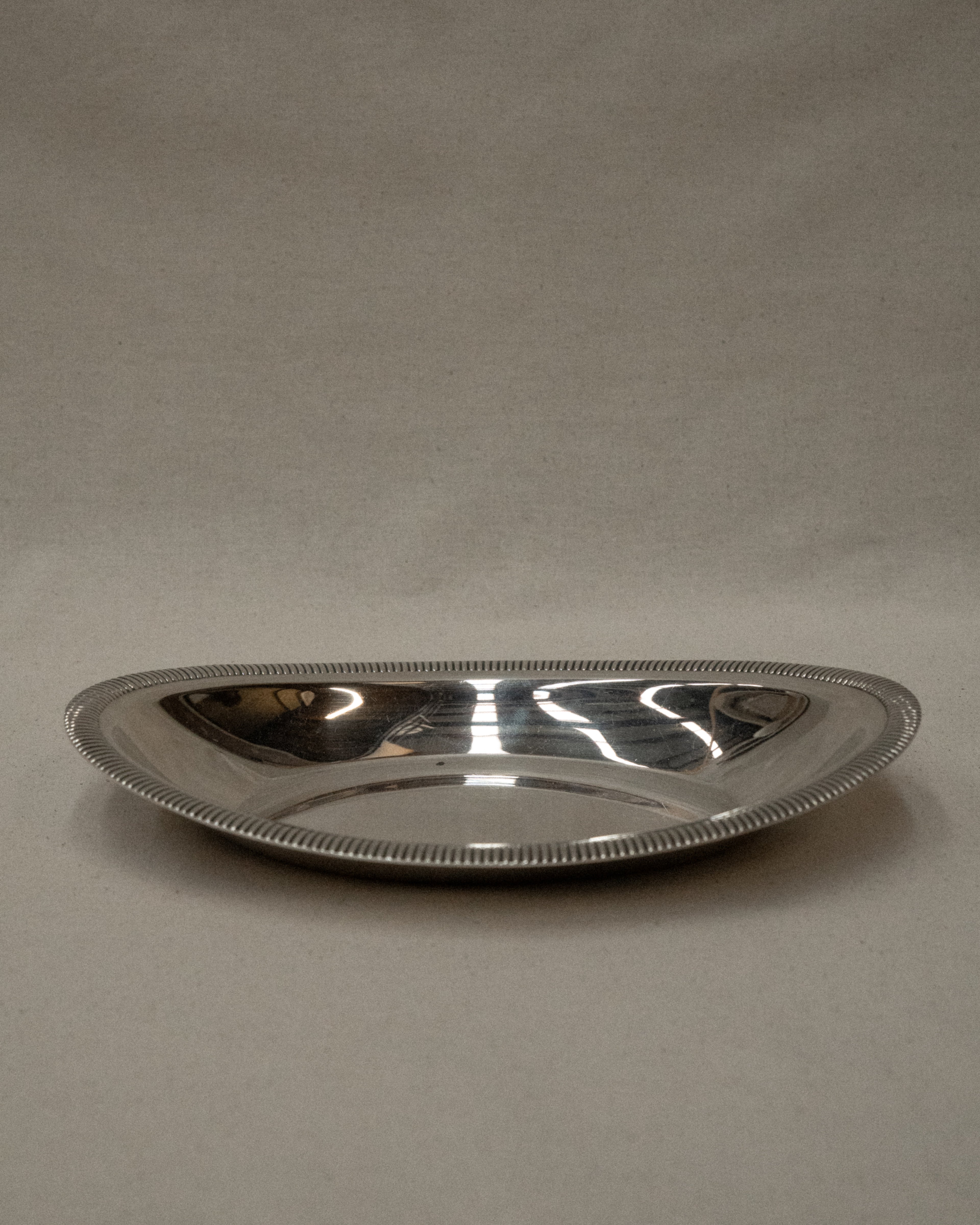 Silver plated tray in dip shape