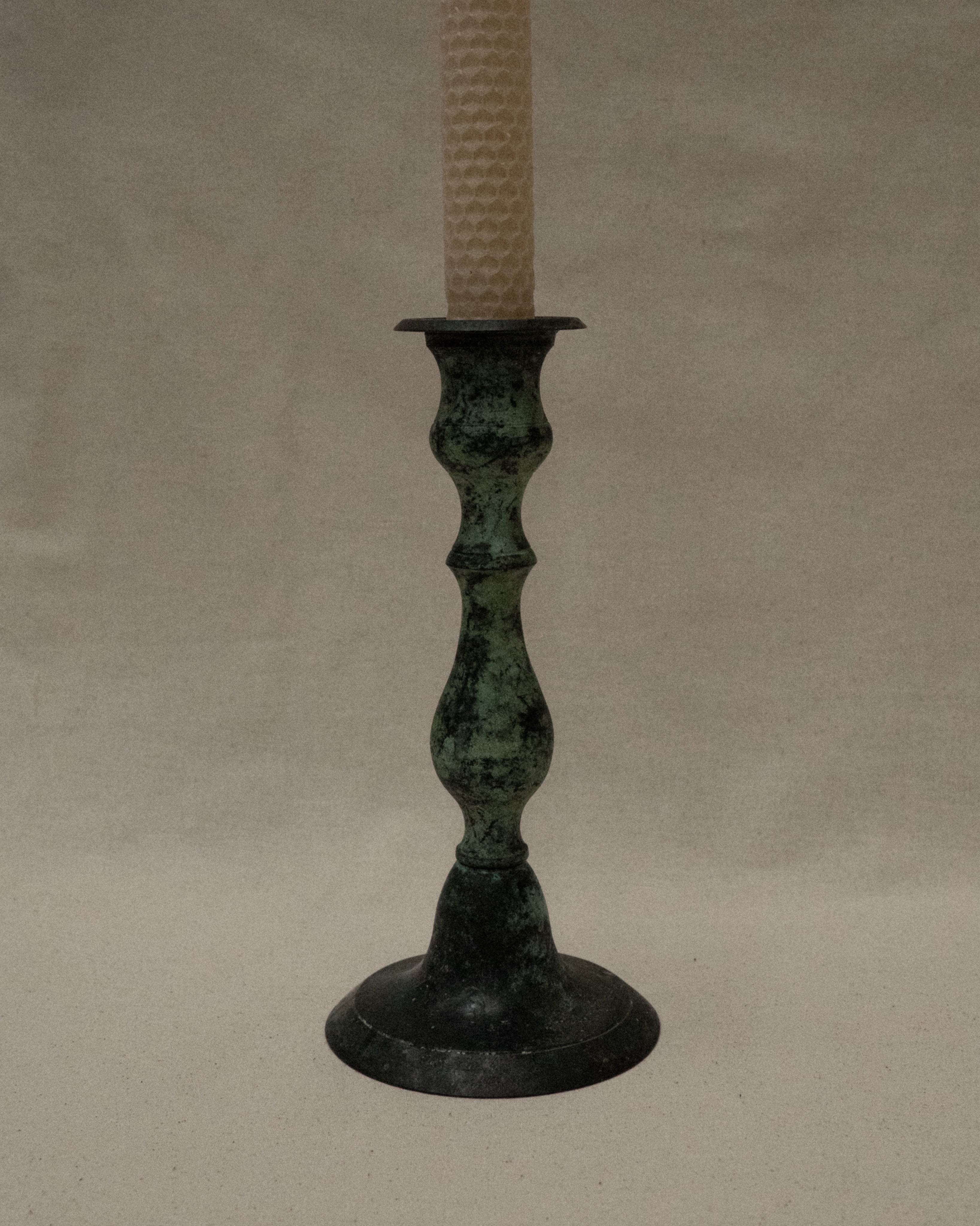 Pair of intentional verdigris candle holders