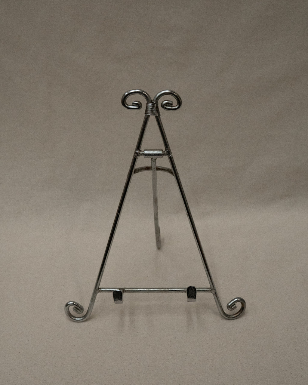 Chrome book stand with spiral feet and top