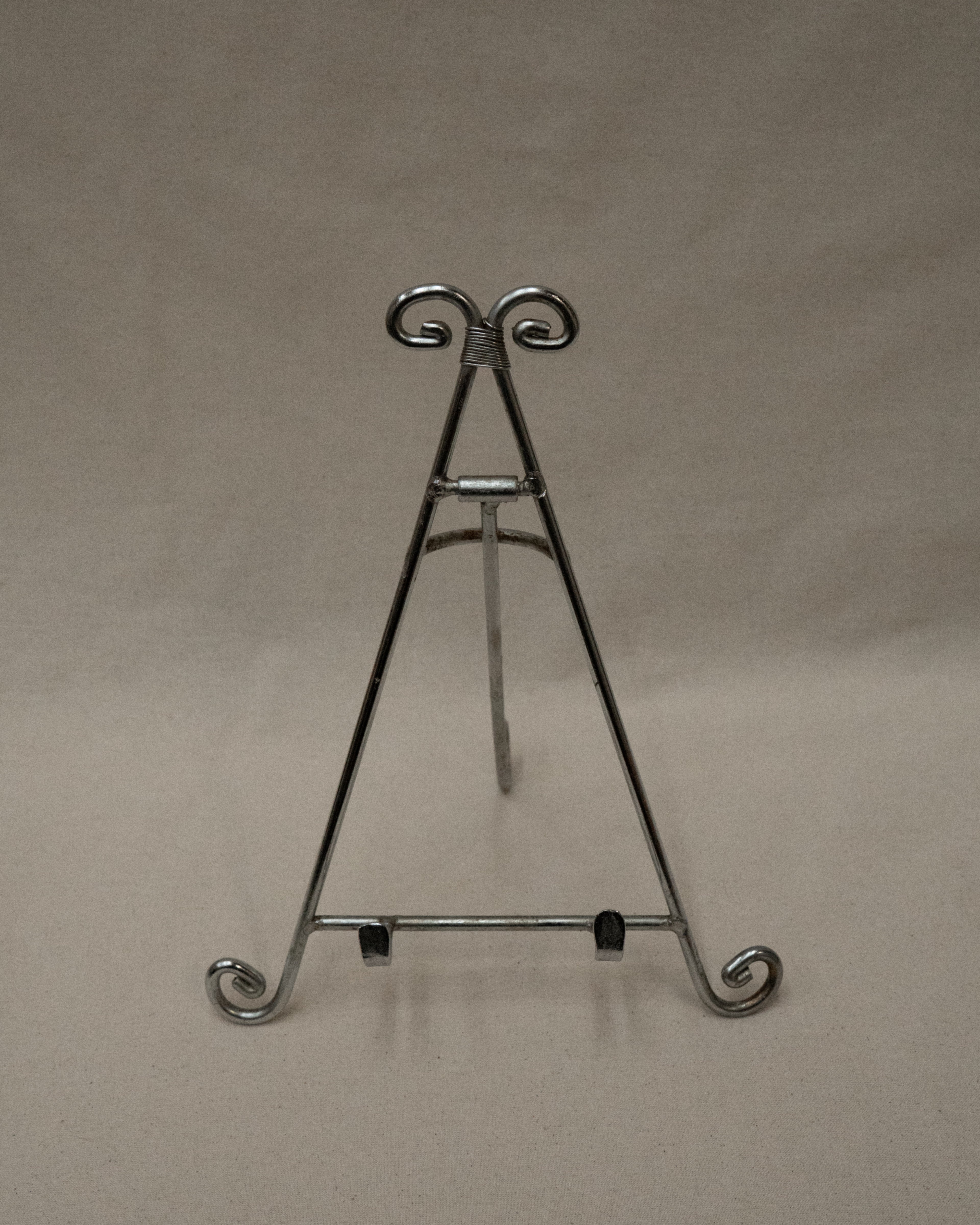 Chrome book stand with spiral feet and top