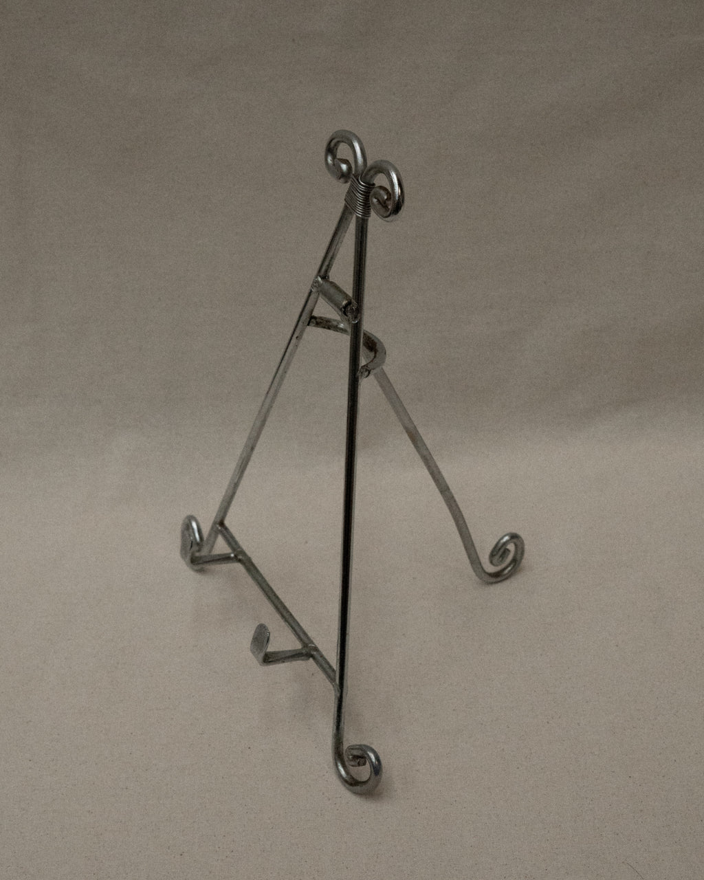 Chrome book stand with spiral feet and top
