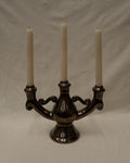 Ceramic candelabra with a reflective brown glaze