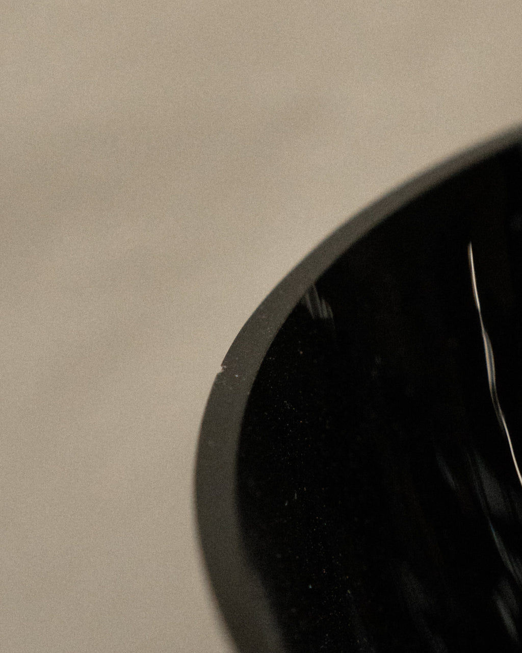 Black opaque art glass vase with transparent base