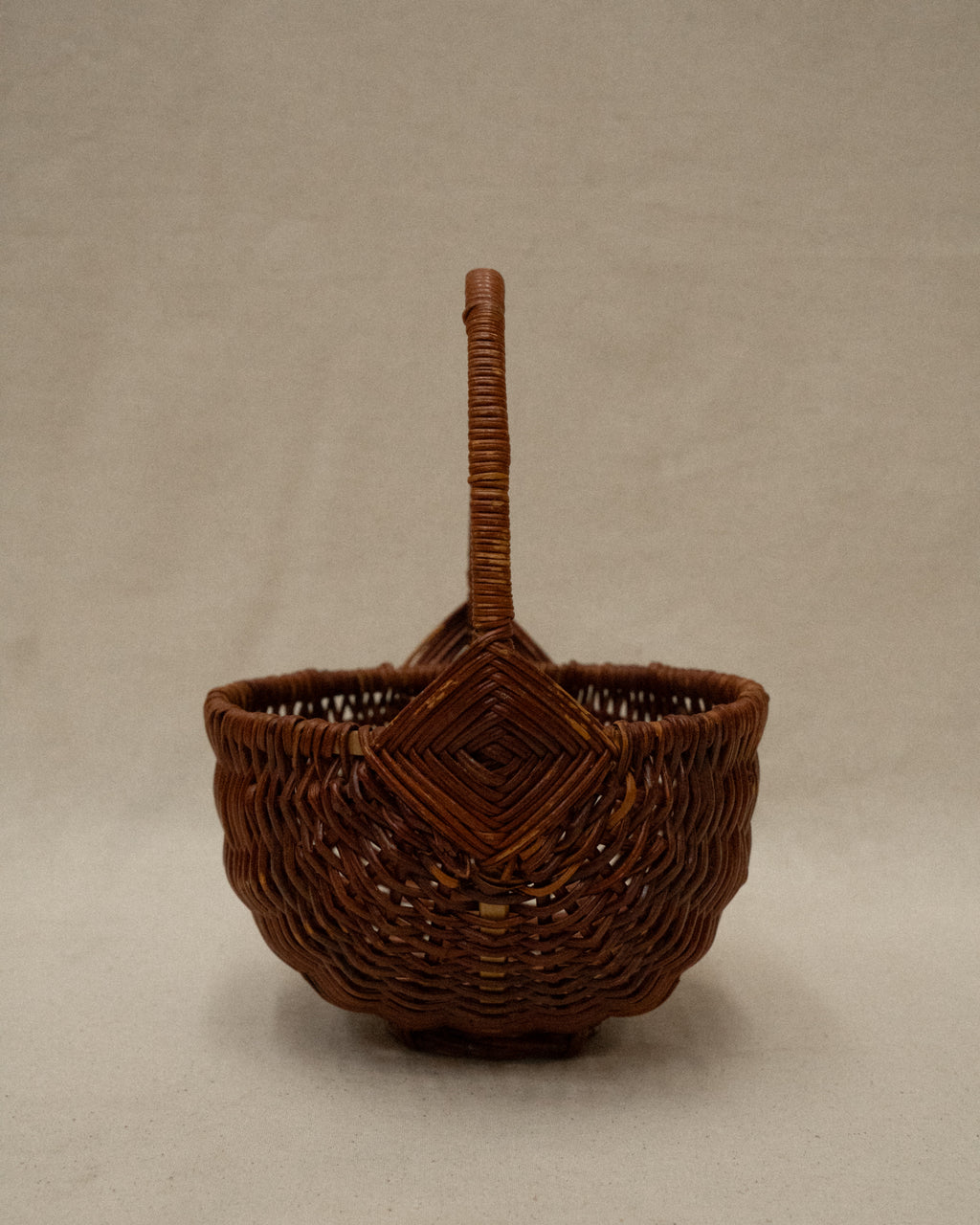 Small wicker basket with handle