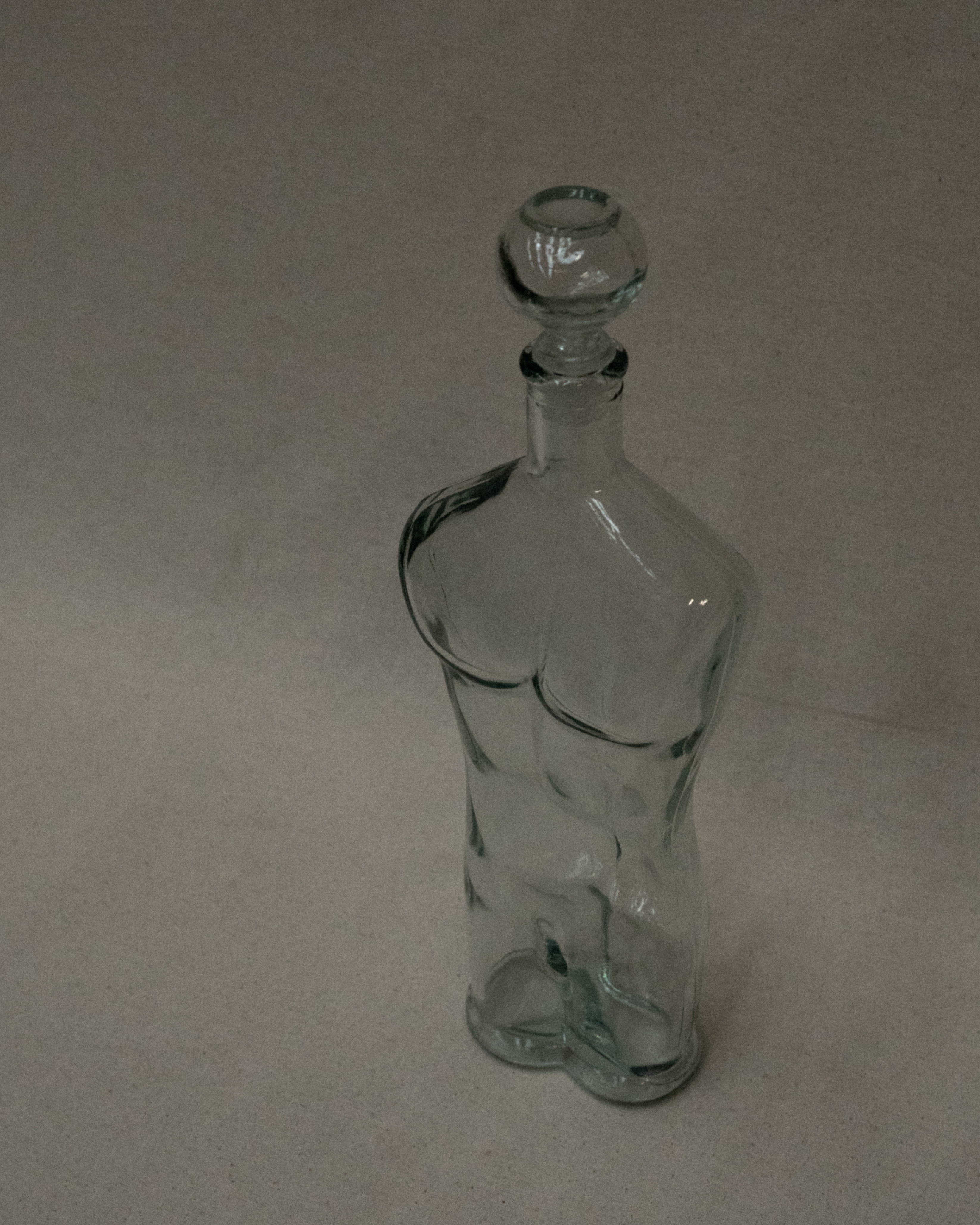 Male torso glass bottle with stopper