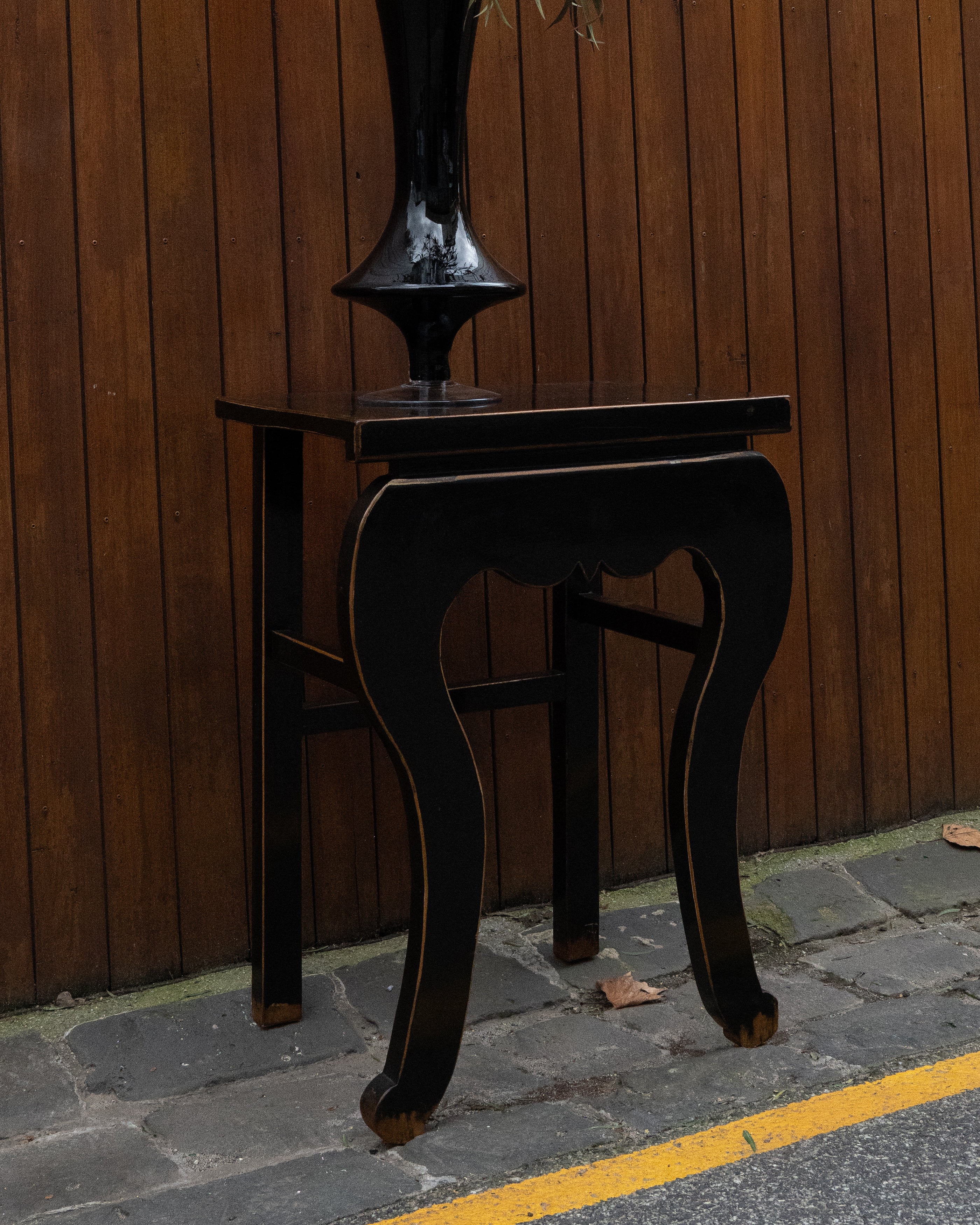 Black laquered chinese table with exposed edges
