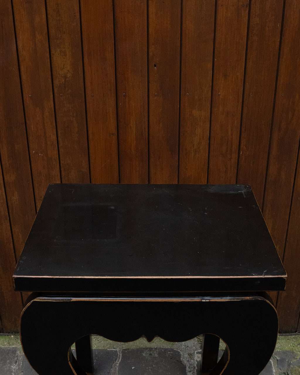 Black laquered chinese table with exposed edges