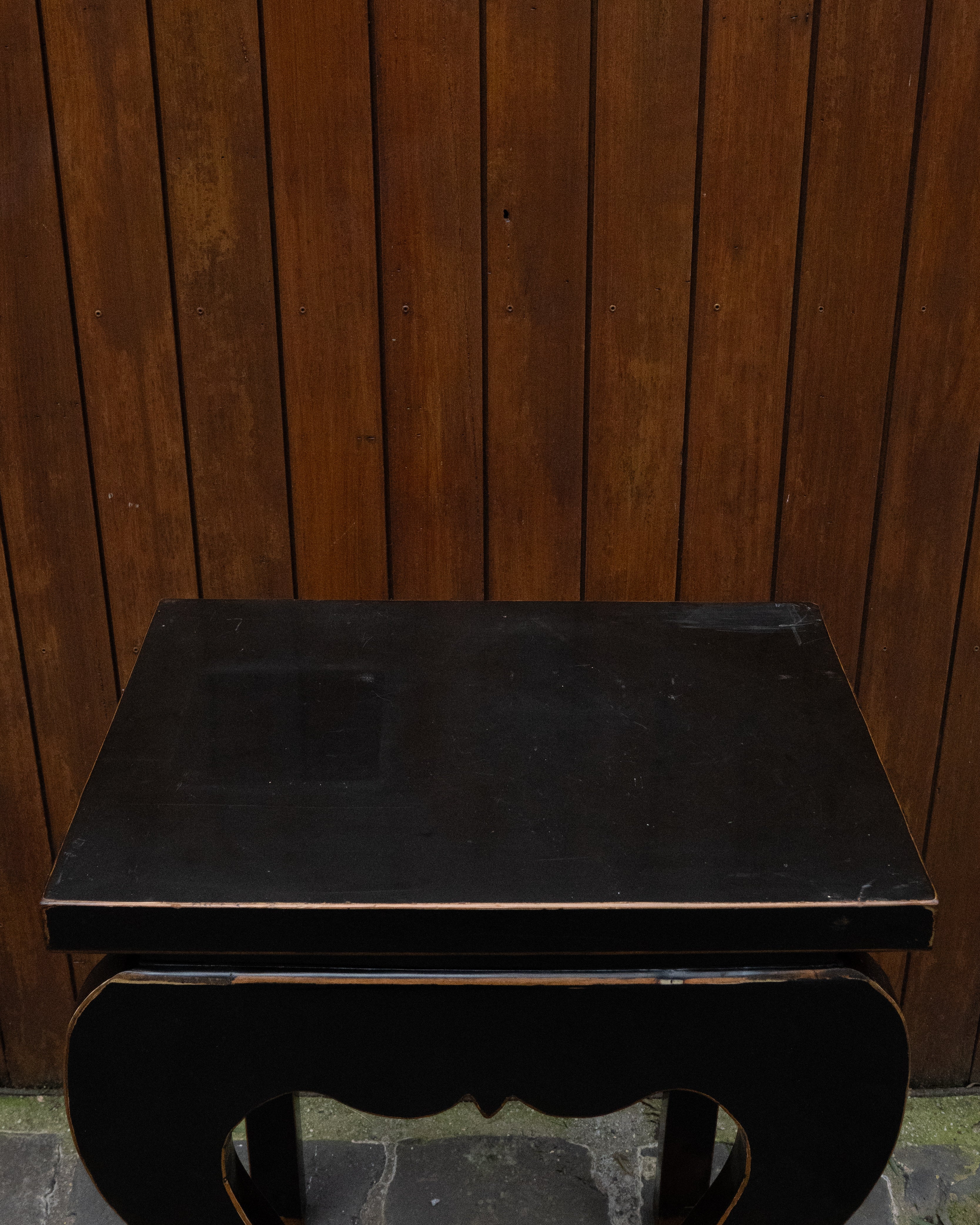 Black laquered chinese table with exposed edges