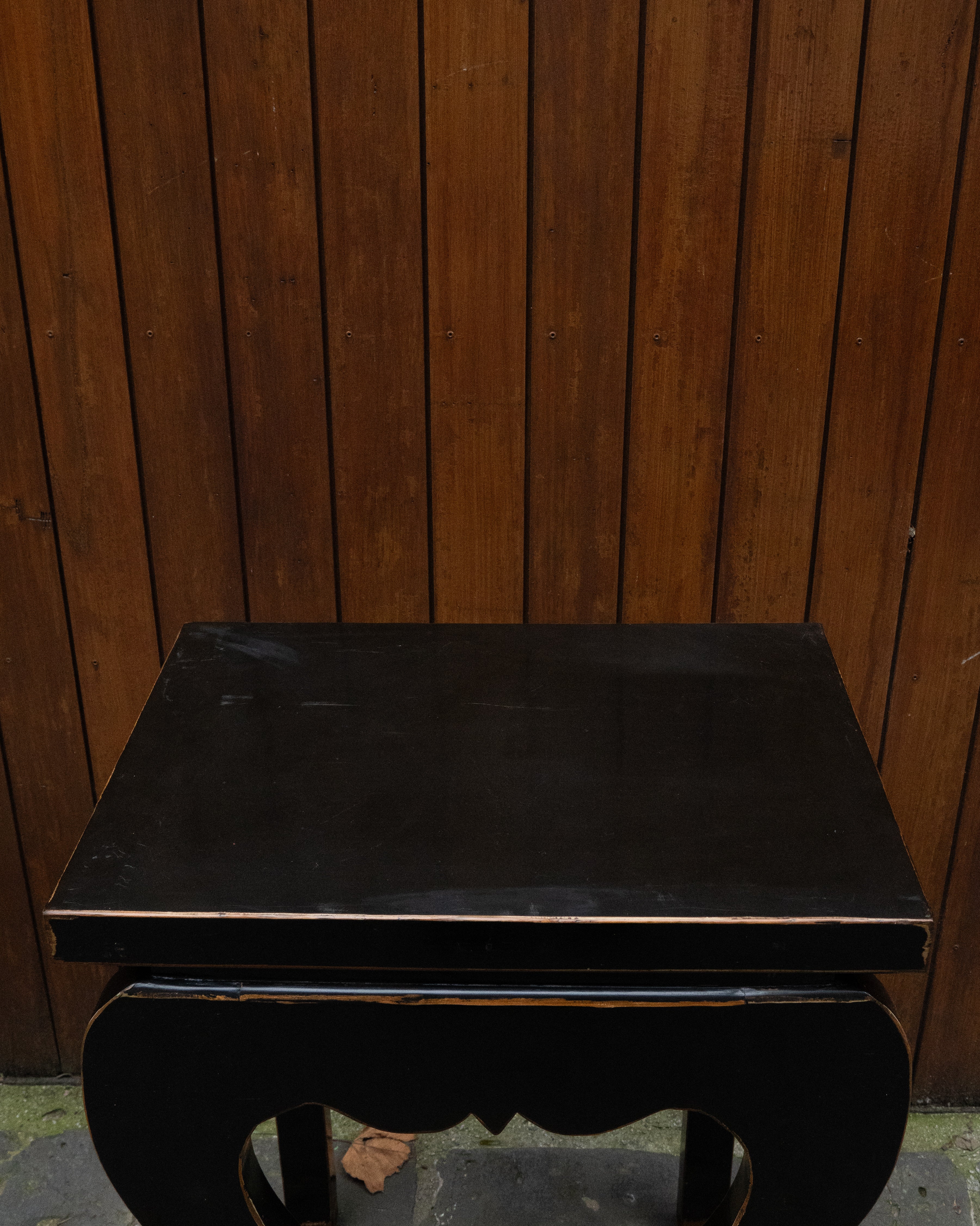 Black laquered chinese table with exposed edges