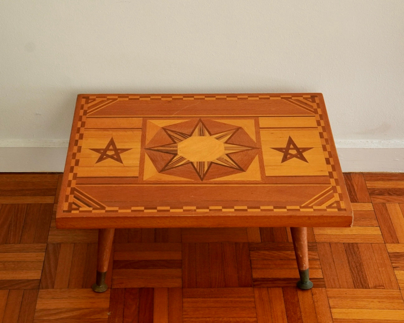 Wood marquetry table with star shaped inlays
