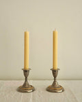Pair of silver plated candle holders with gold and silver rope detailing