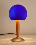 Art deco blue glass lamp with wooden and metal base