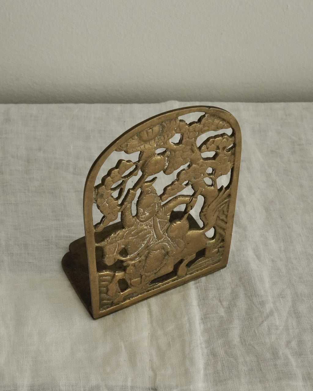 Brass chinese man on a horse bookend