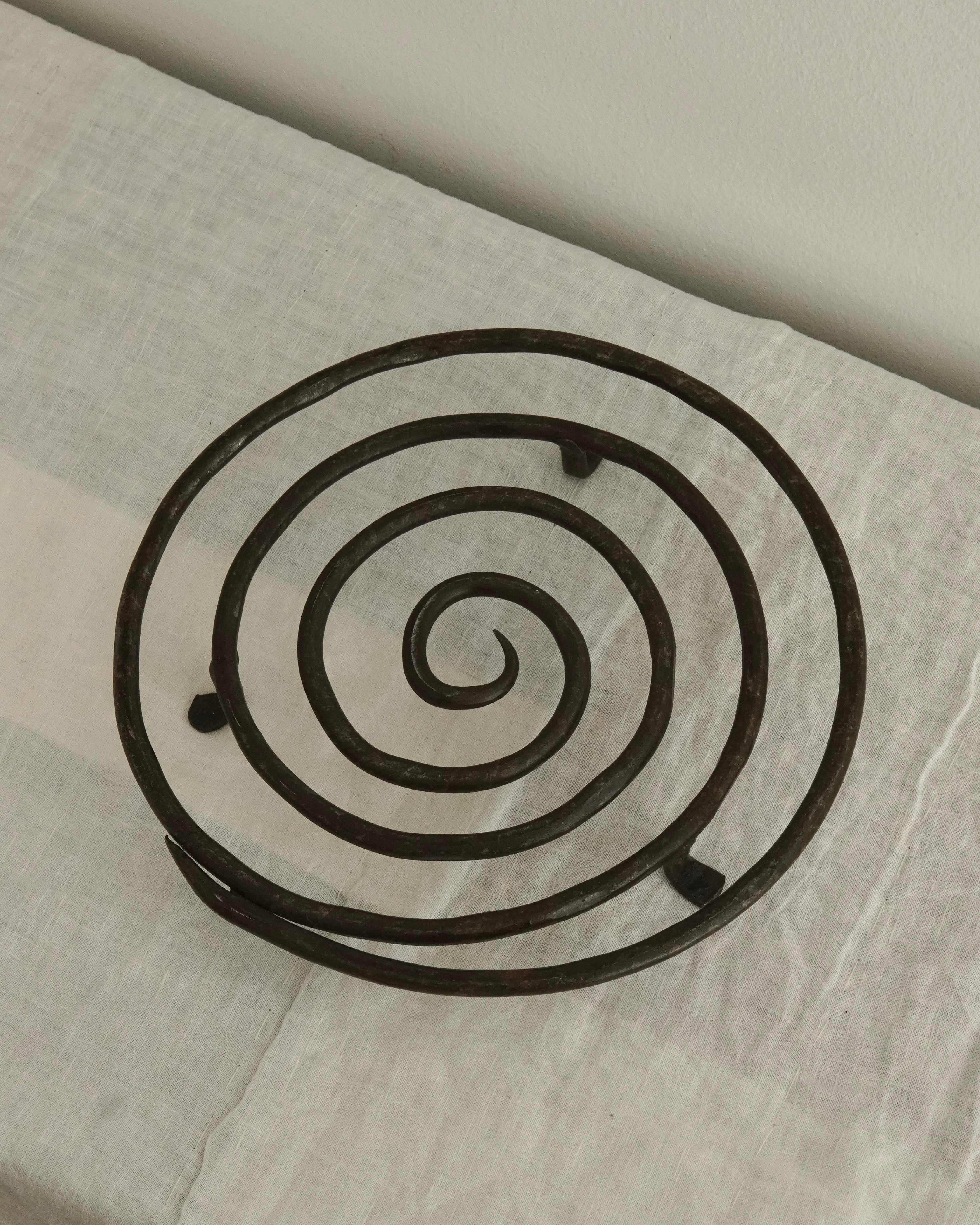 Wrought iron spiral trivet with tapered ends