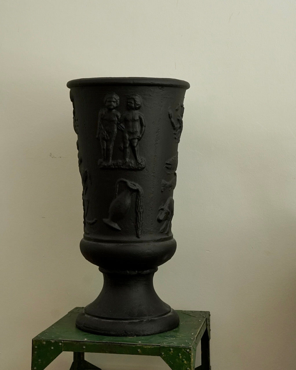 Black concrete vase with horoscope details