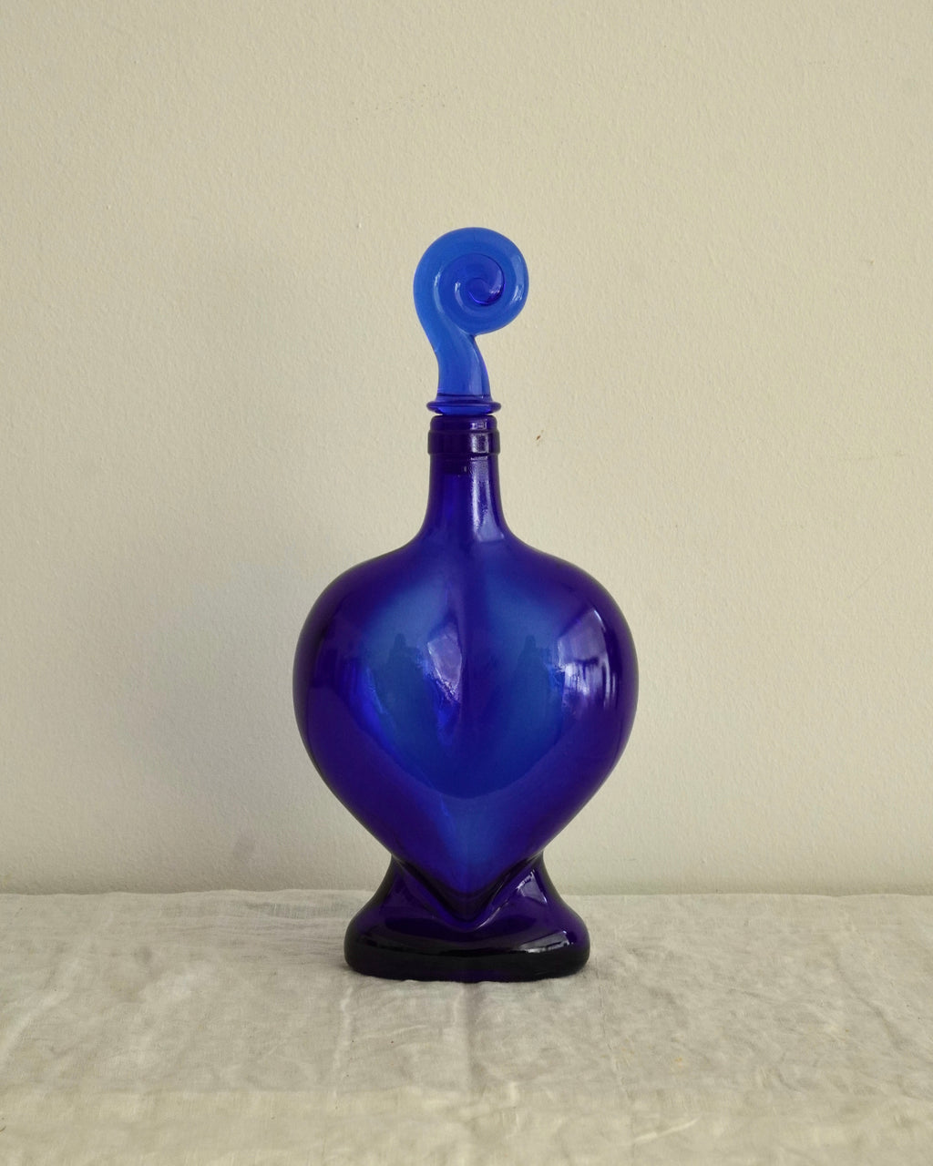 Blue heart shaped bottle with spiral topper/stopper