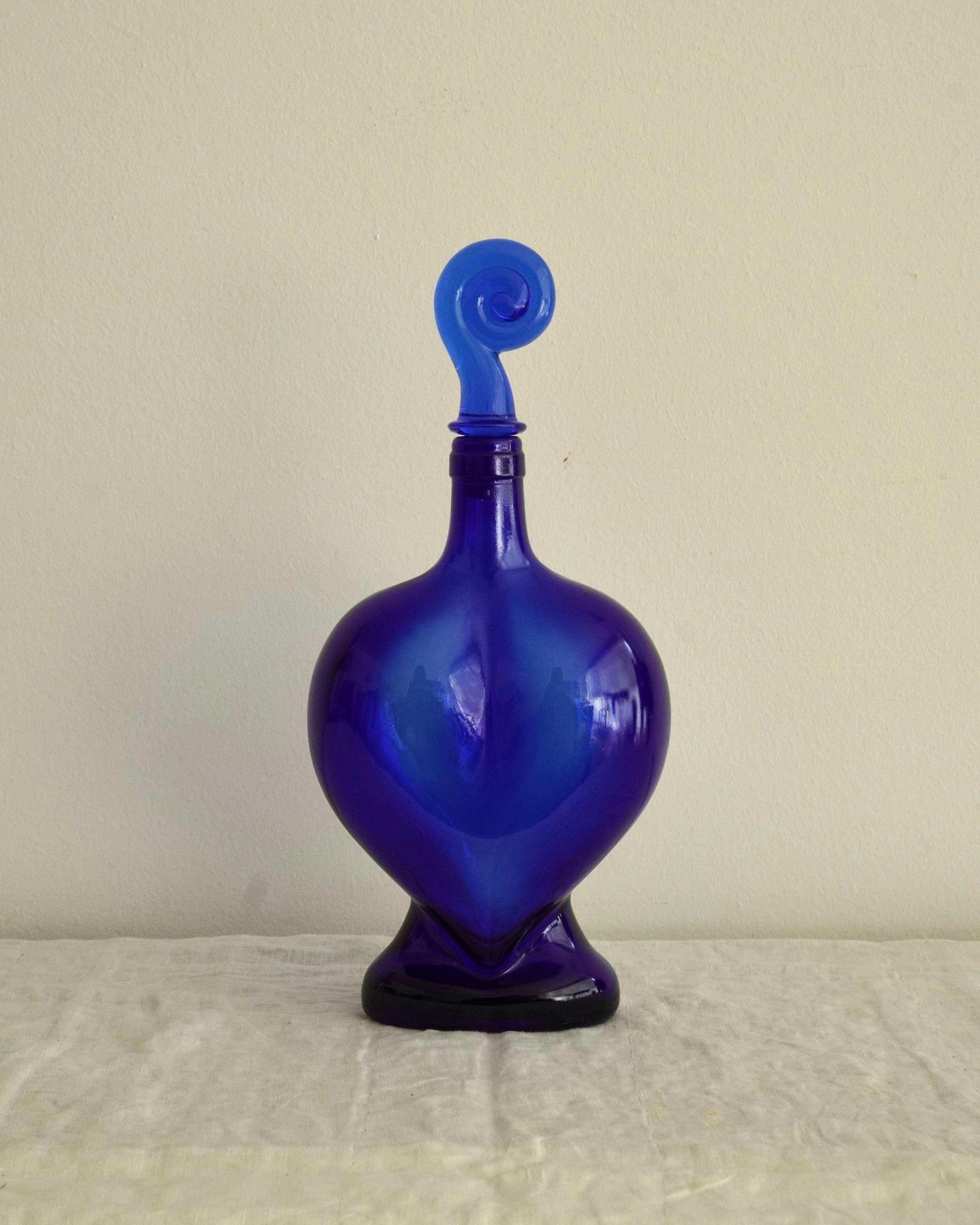 Blue heart shaped bottle with spiral topper/stopper