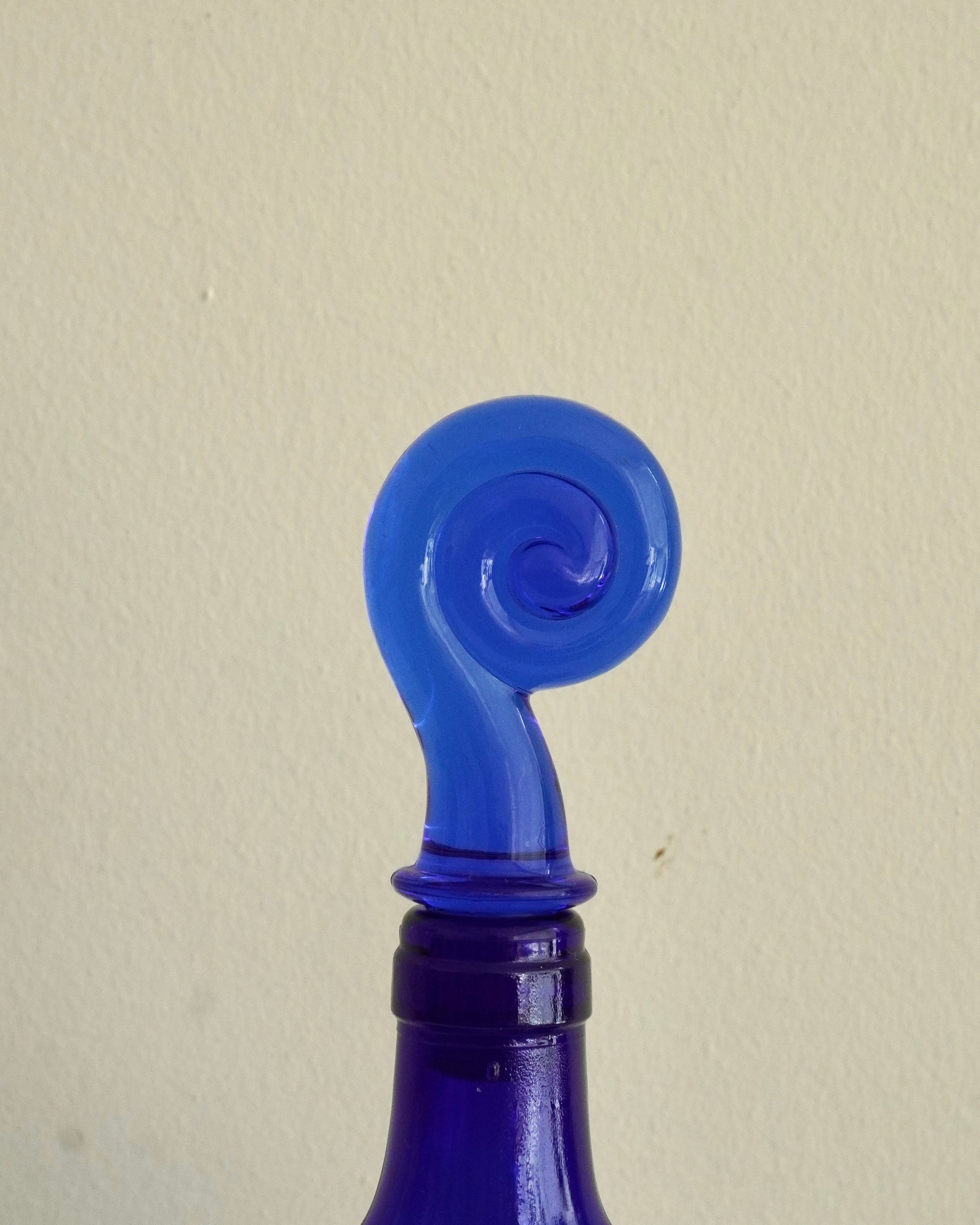 Blue heart shaped bottle with spiral topper/stopper