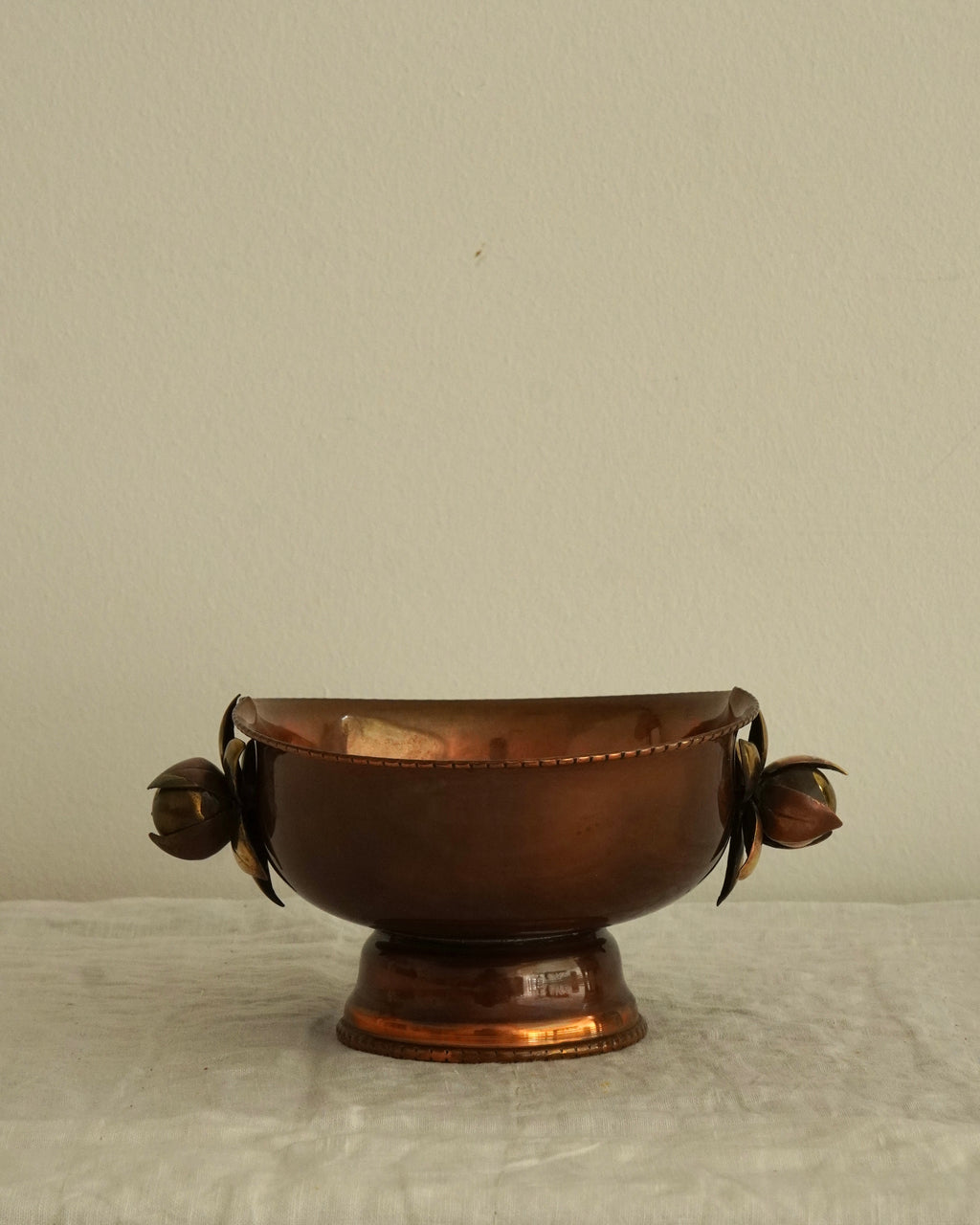 Copper bowl with flower handles