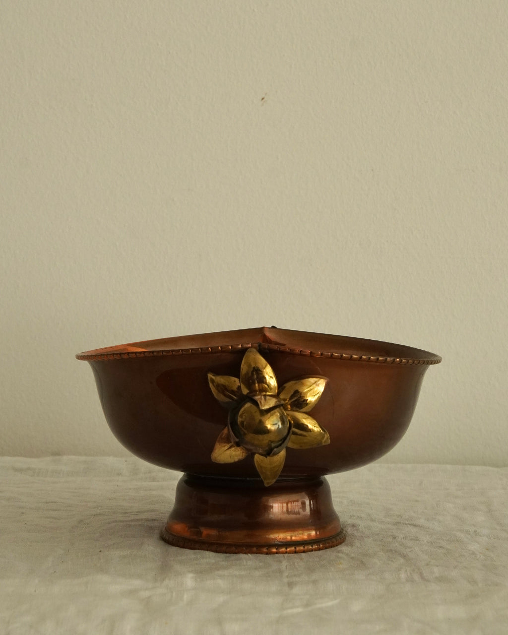 Copper bowl with flower handles
