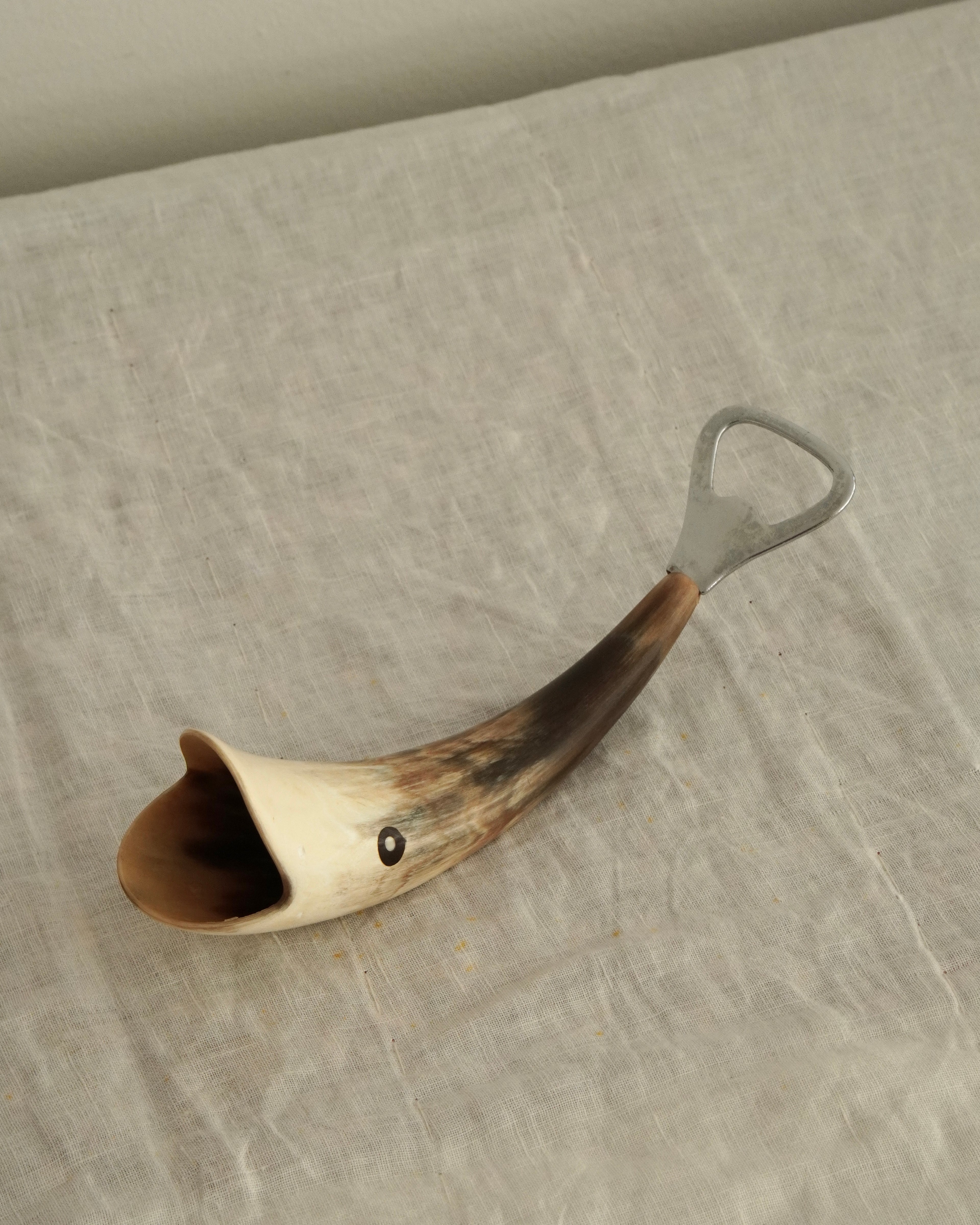 Whale bottle opener made of horn