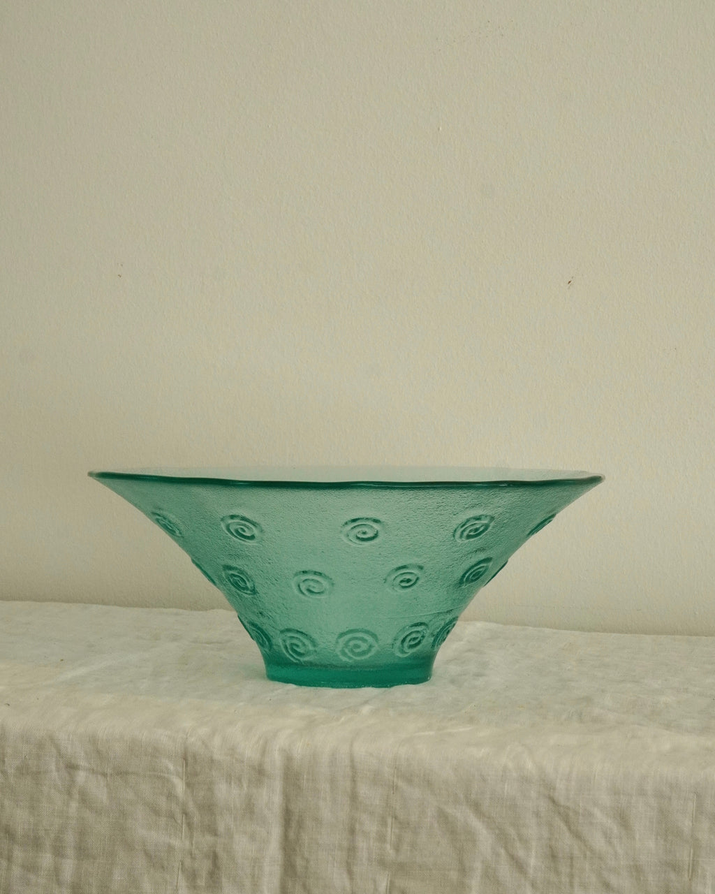 Tinted green glass swirl bowl