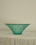 Tinted green glass swirl bowl