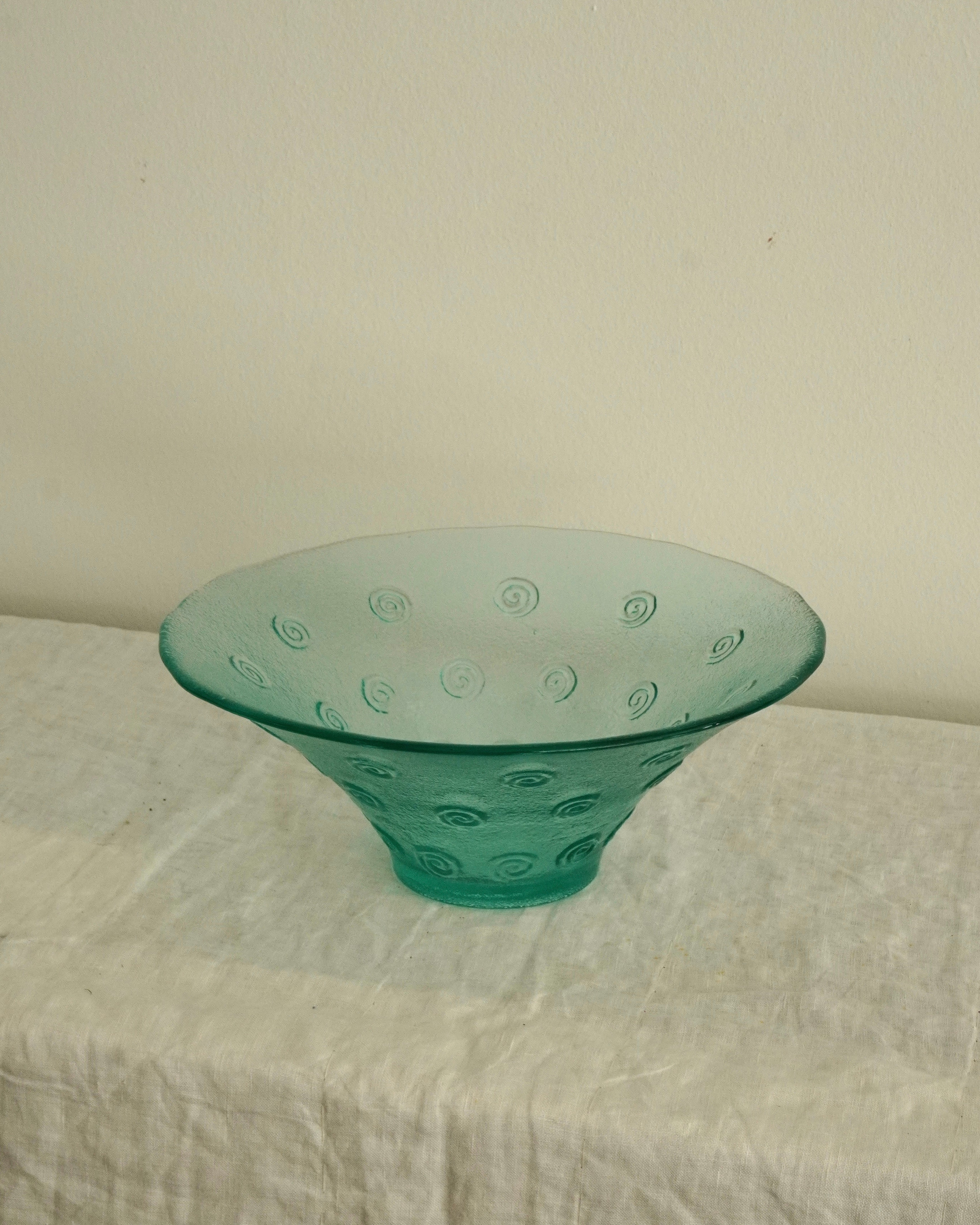 Tinted green glass swirl bowl