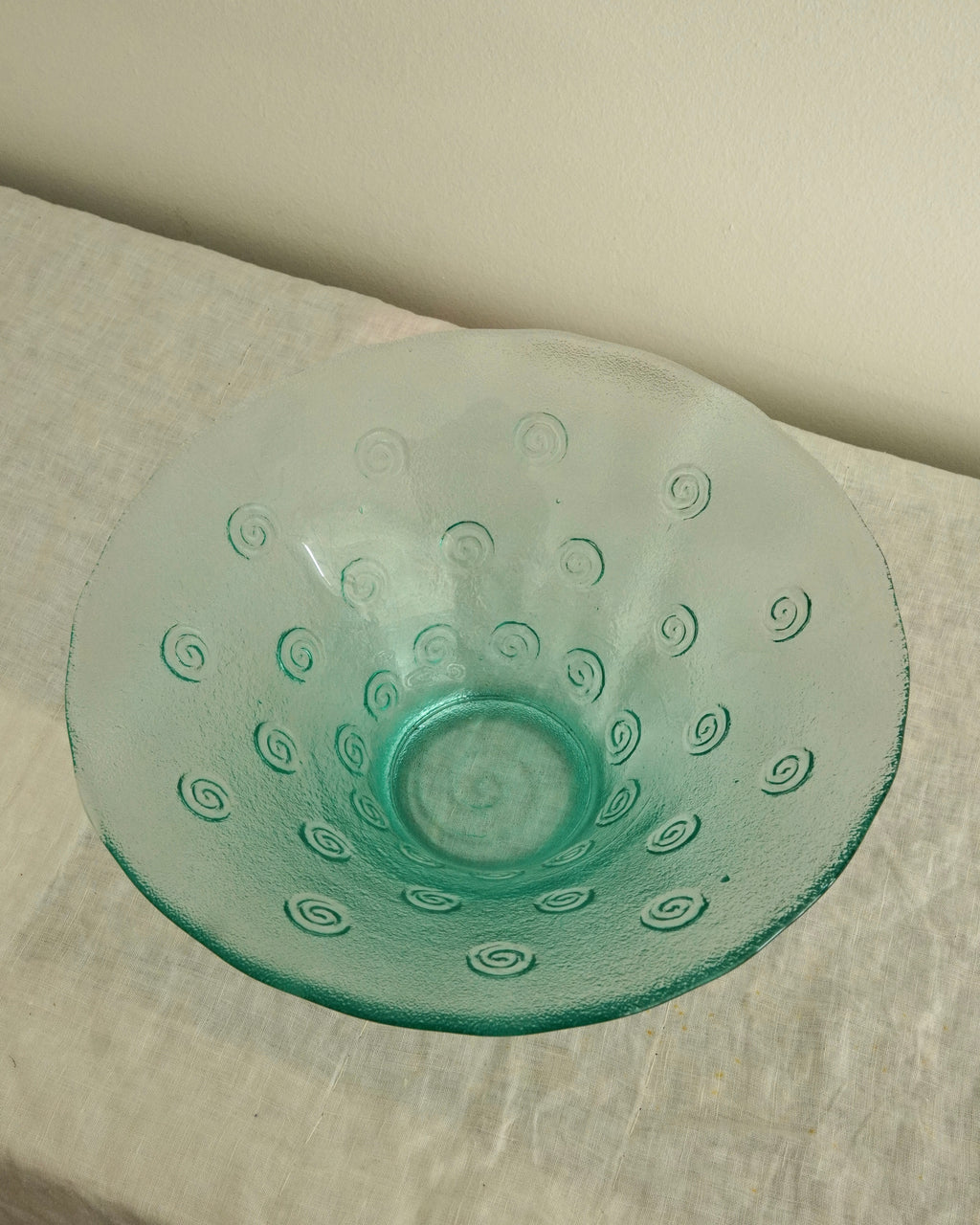 Tinted green glass swirl bowl