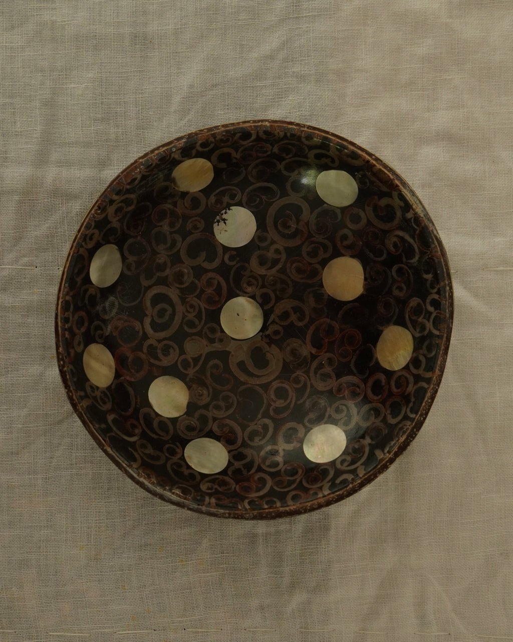 Coconut shell trinket bowl with spiral motif and mother of pearl inlay
