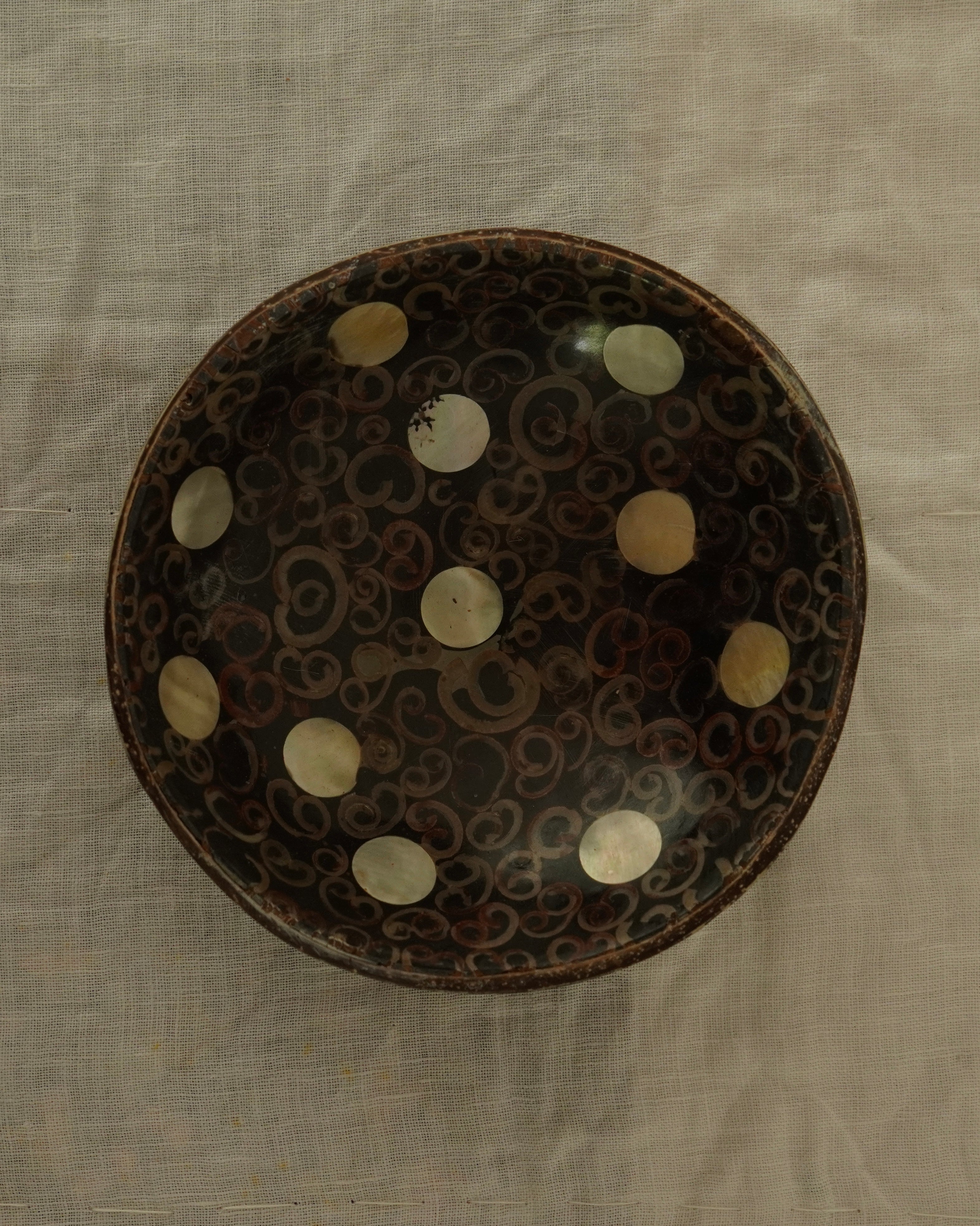 Coconut shell trinket bowl with spiral motif and mother of pearl inlay