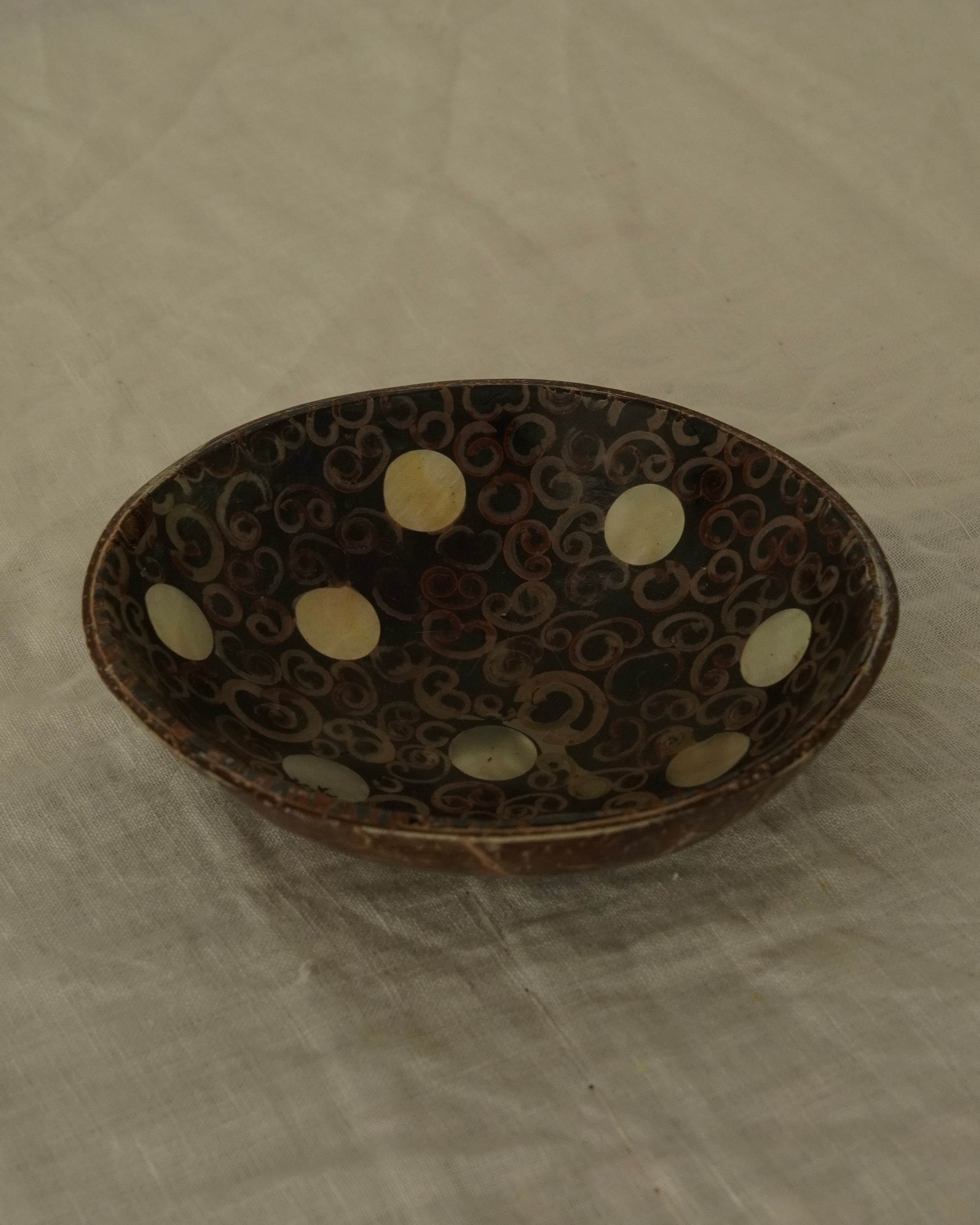 Coconut shell trinket bowl with spiral motif and mother of pearl inlay