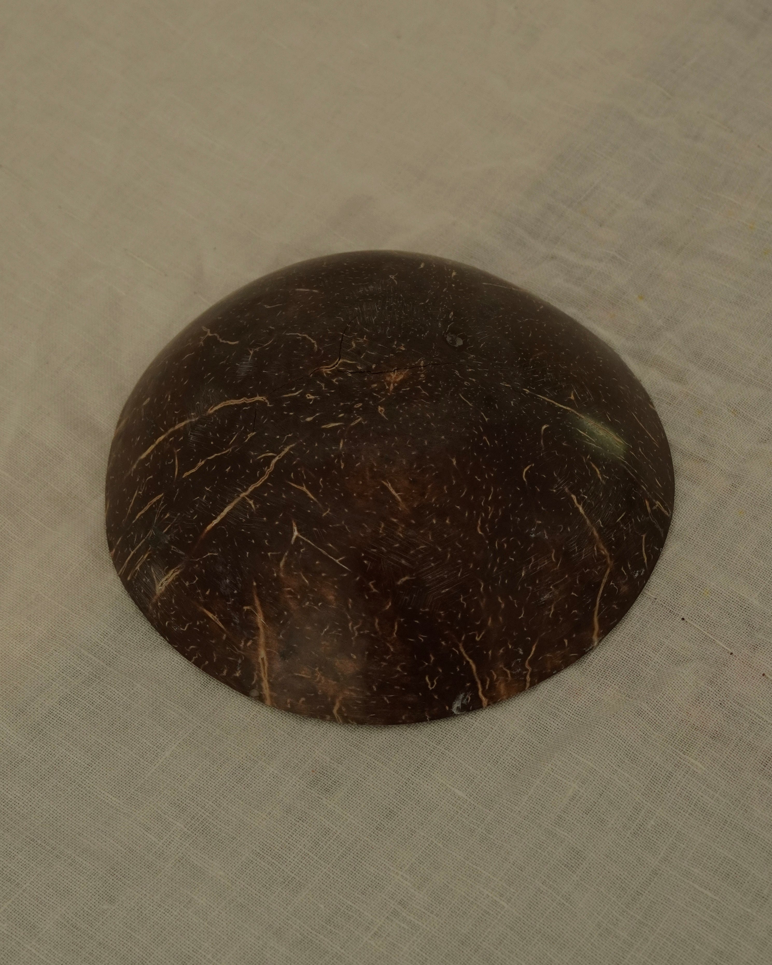 Coconut shell trinket bowl with spiral motif and mother of pearl inlay