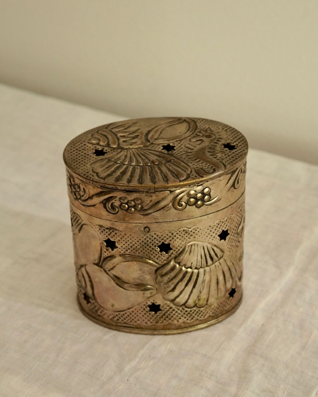 Embossed seashells and seahorses and star cutouts tin trinket box