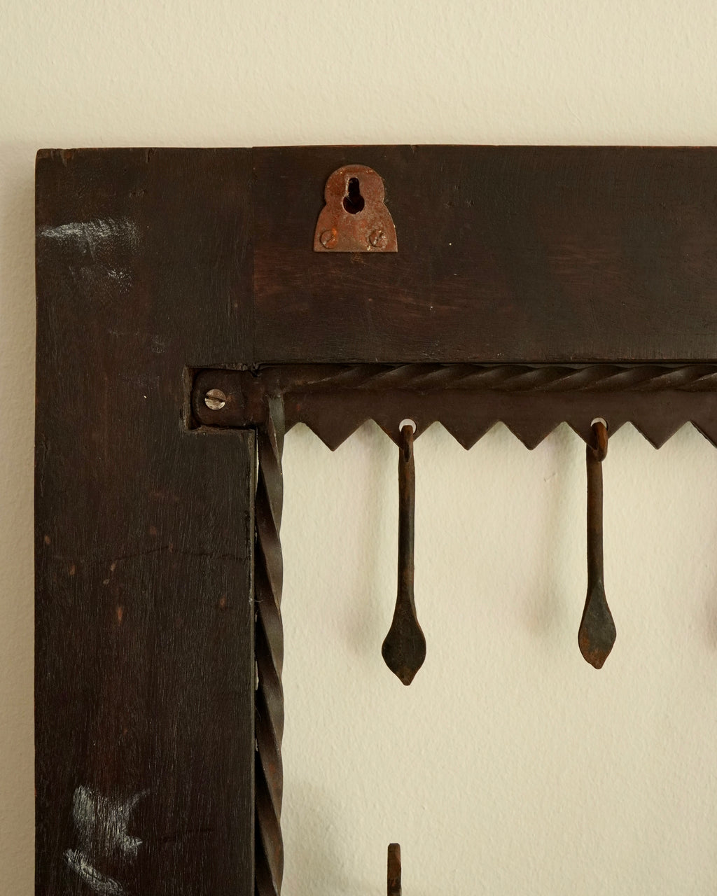 Ethnographic wall mounted panel featuring wrought iron animal and human figures