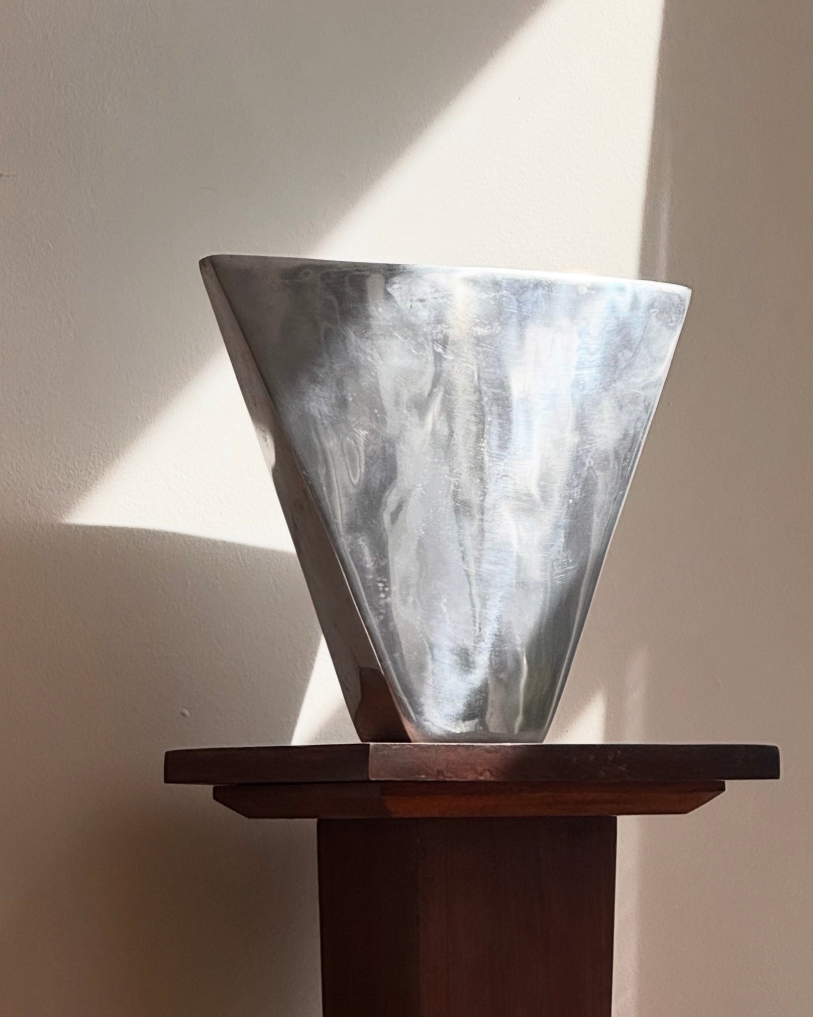 Large aluminum vase in a triangle shape