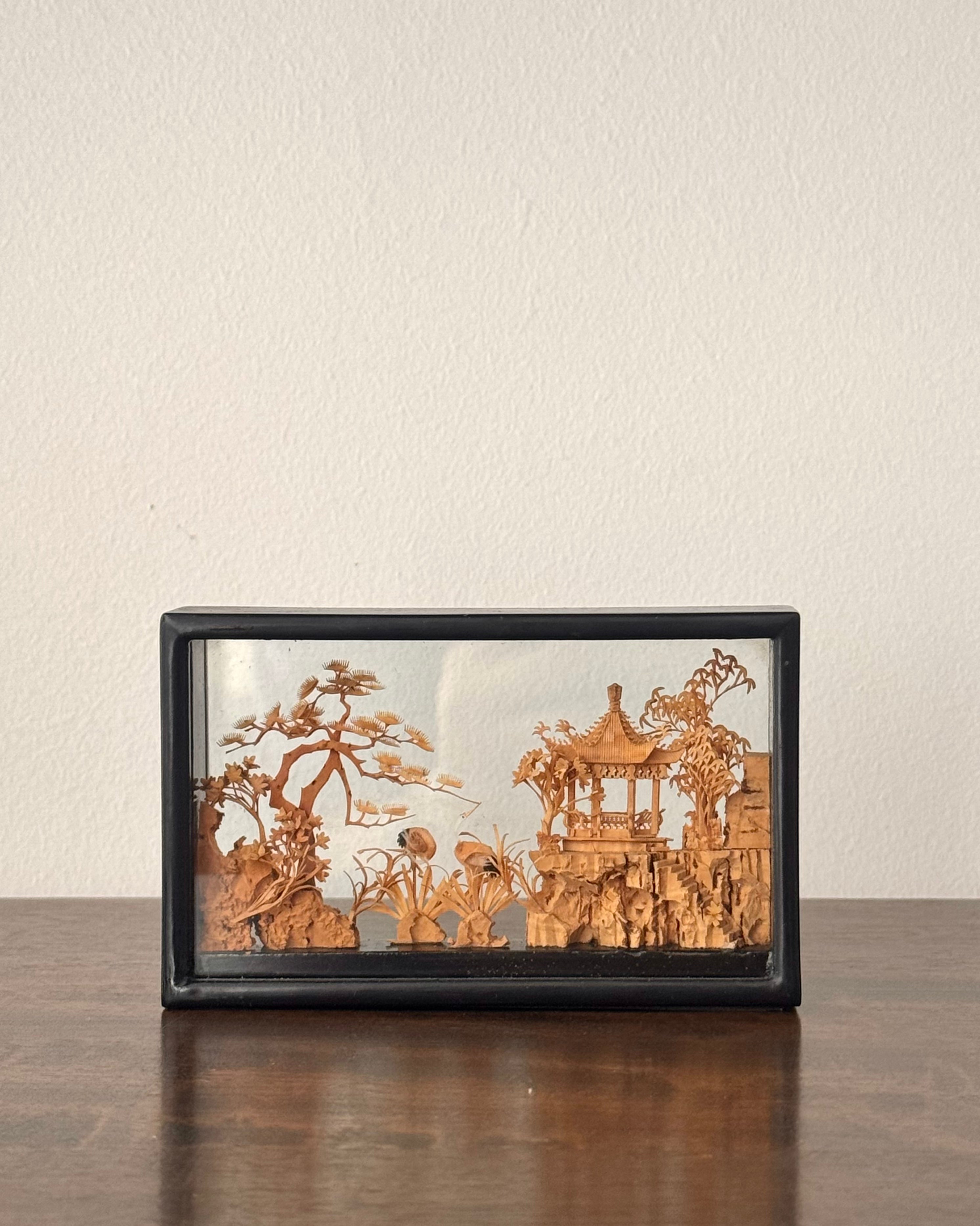 Chinese hand carved diorama feauturing a pagoda and stalks (rectangle)