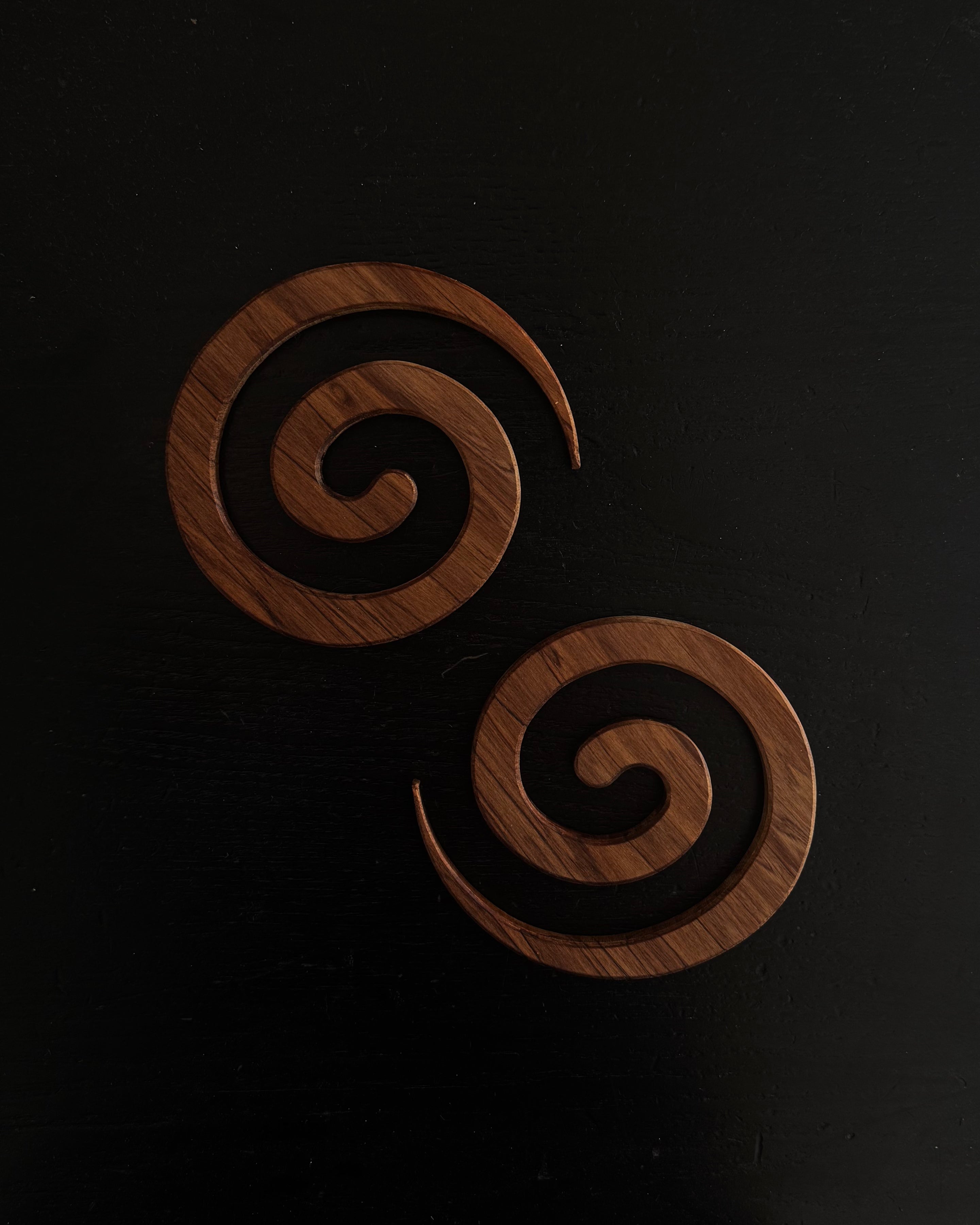 Pair of NZ rimu wood spiral coasters
