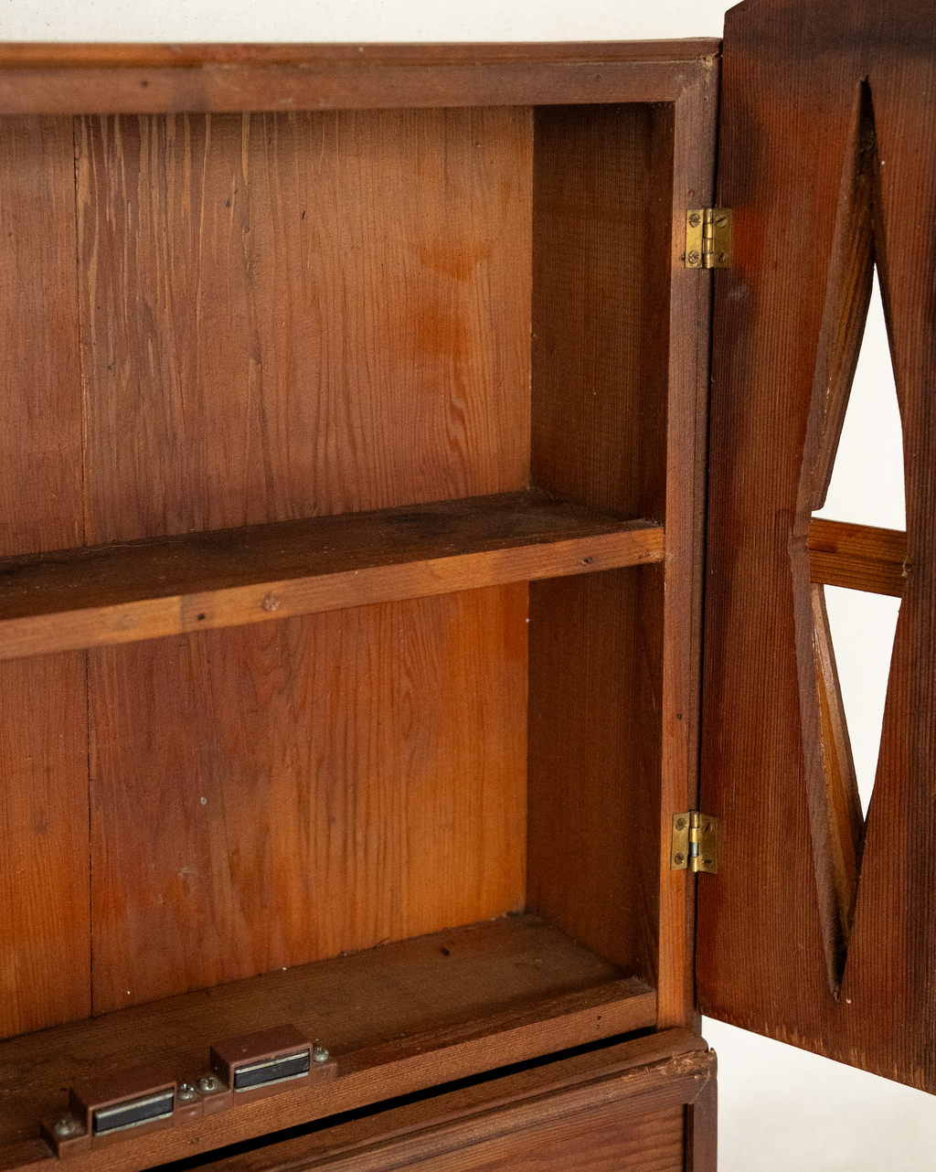 Wooden gothic style cabinet with shelving, two doors and a drawer